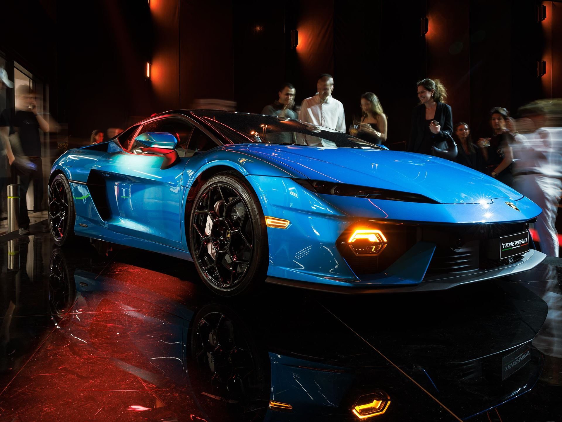 Lamborghini Opens Its First Official Showroom In Georgia, Premiering The Temerario In Tbilisi 3 Blue lamborghini temerario on display at the tbilisi launch event, surrounded by attendees under dynamic lighting