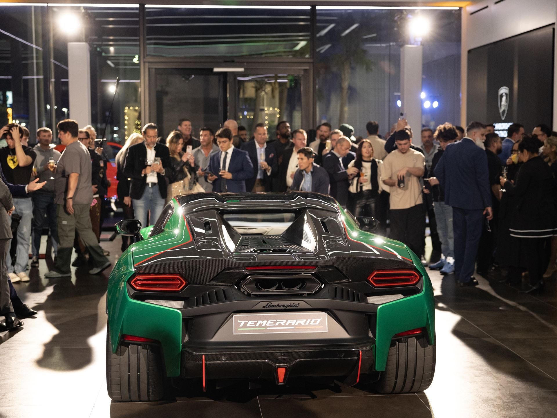 Lamborghini'S Temerario Brings A 10,000 Rpm V8 To Florida'S Seventh Showroom 3 Rear view of the green lamborghini temerario on display at the south dade showroom opening event, showing aggressive diffuser and distinctive taillights