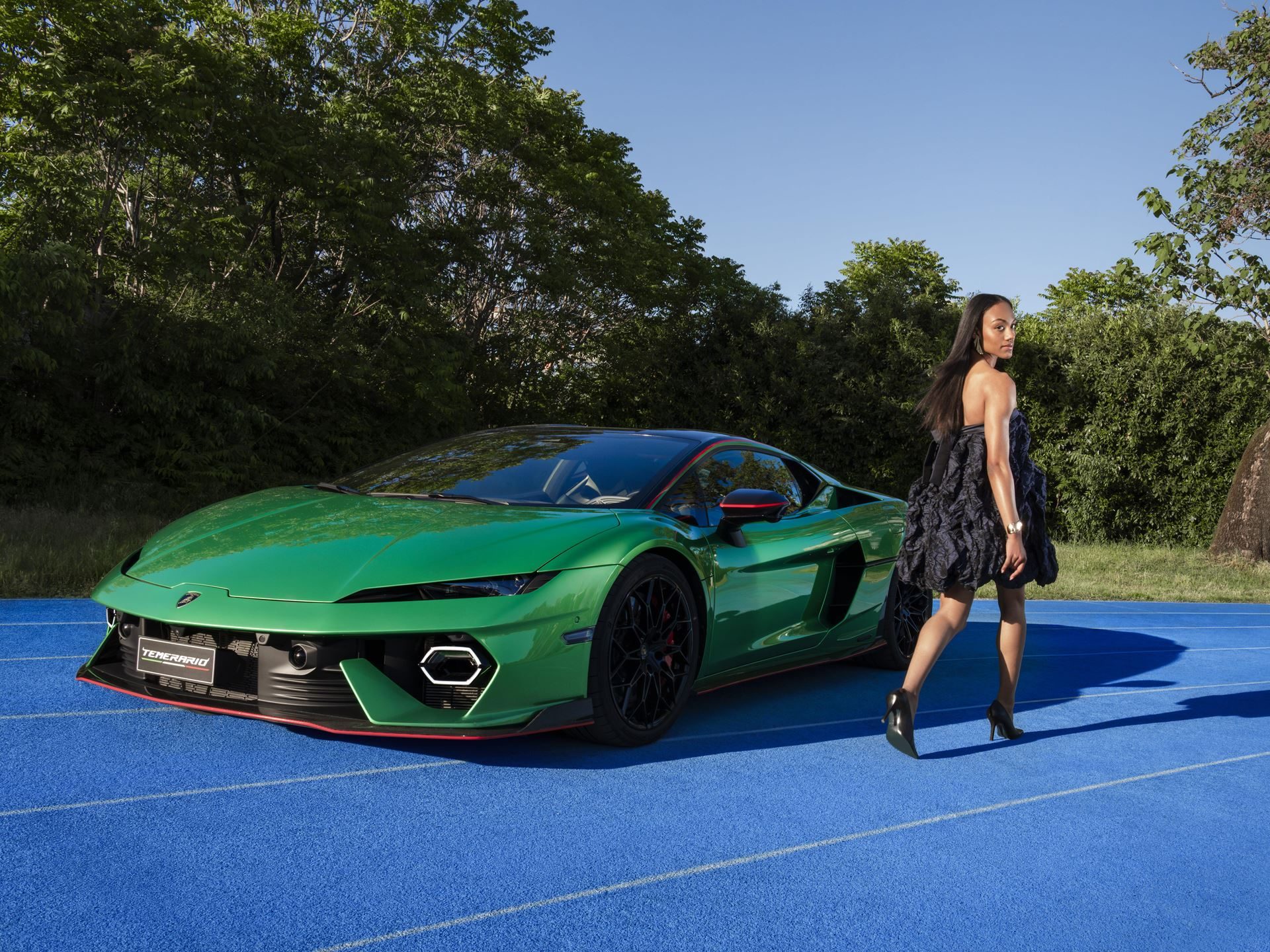 Lamborghini'S Temerario Campaign With Larissa Iapichino Sells The Physics Of The Split Second 3 Front three-quarter view of a green lamborghini temerario on a blue running track