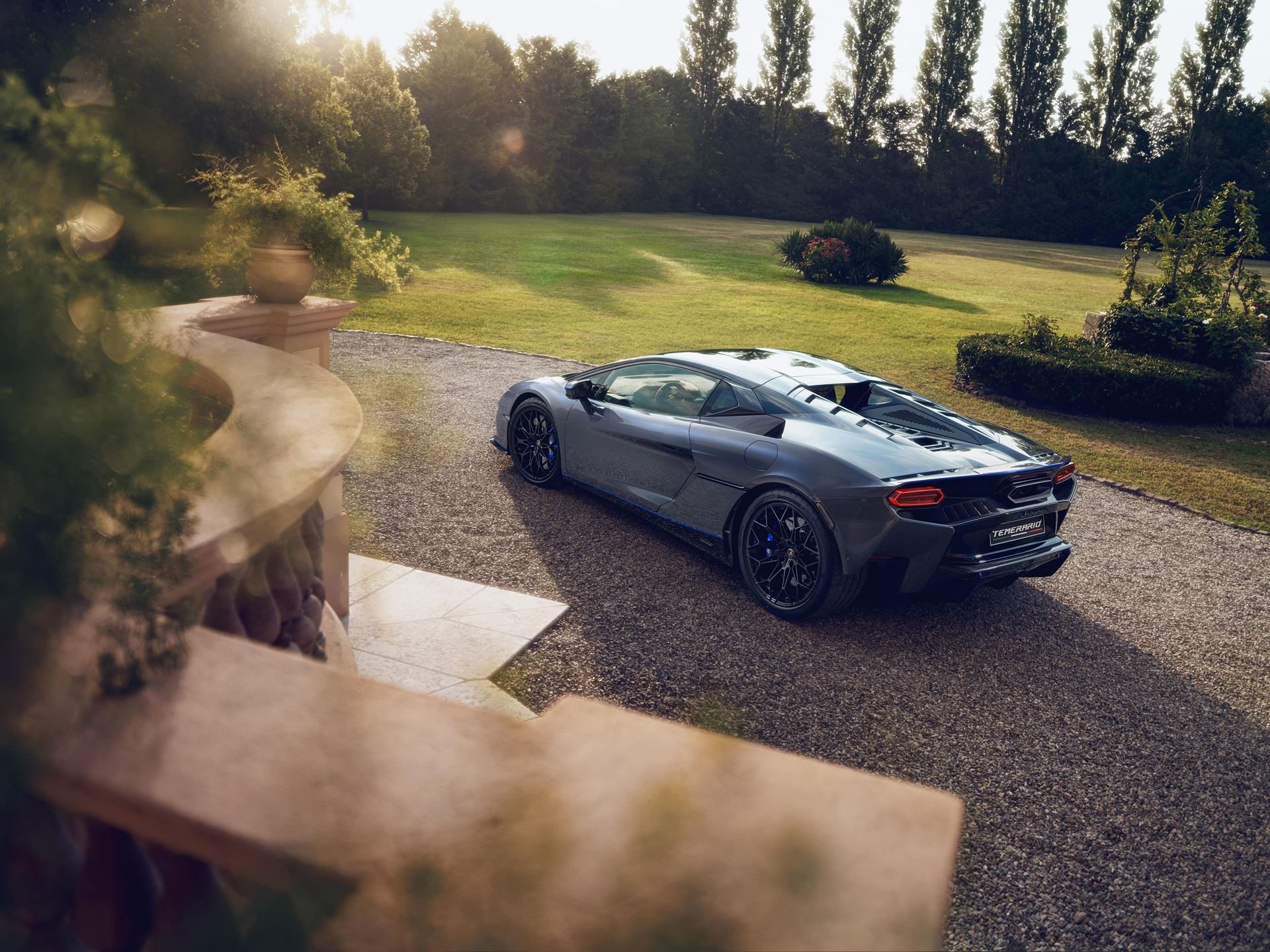 Lamborghini'S First Bespoke Temerario Proves Ad Personam Is The Real Power Play 9 Rear three-quarter view of the temerario porto cervo in golden hour light showing the rear diffuser and blue accent line