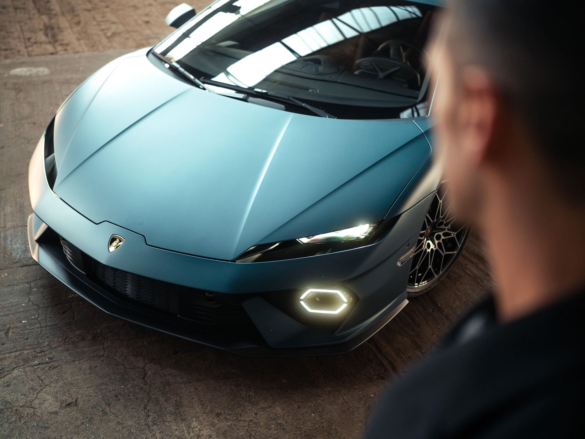 Lamborghini Temerario: Every Surface Works For Speed, And A Swimmer Explains Why 3 Close-up of the lamborghini temerario's front end showing hexagonal drl elements and air intakes