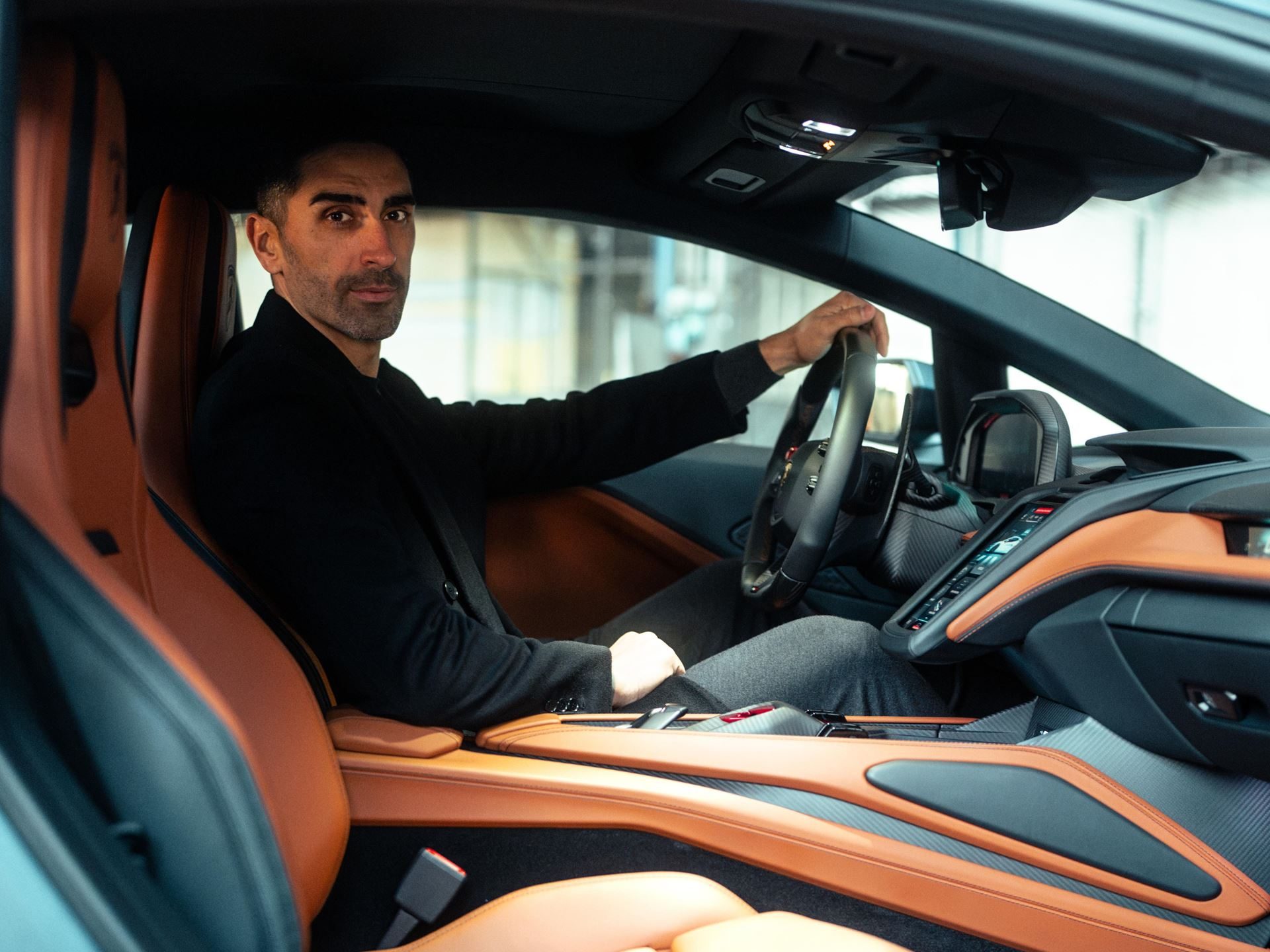 Lamborghini Temerario: Every Surface Works For Speed, And A Swimmer Explains Why 11 Interior of the lamborghini temerario showing sport seats, digital dashboard, carbon fiber trim, and multi-function steering wheel