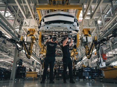Lamborghini'S Dnv Esg Recognition Is About More Than A Certificate 2 Two lamborghini production workers assembling the underside of a white urus on the factory line at sant'agata bolognese