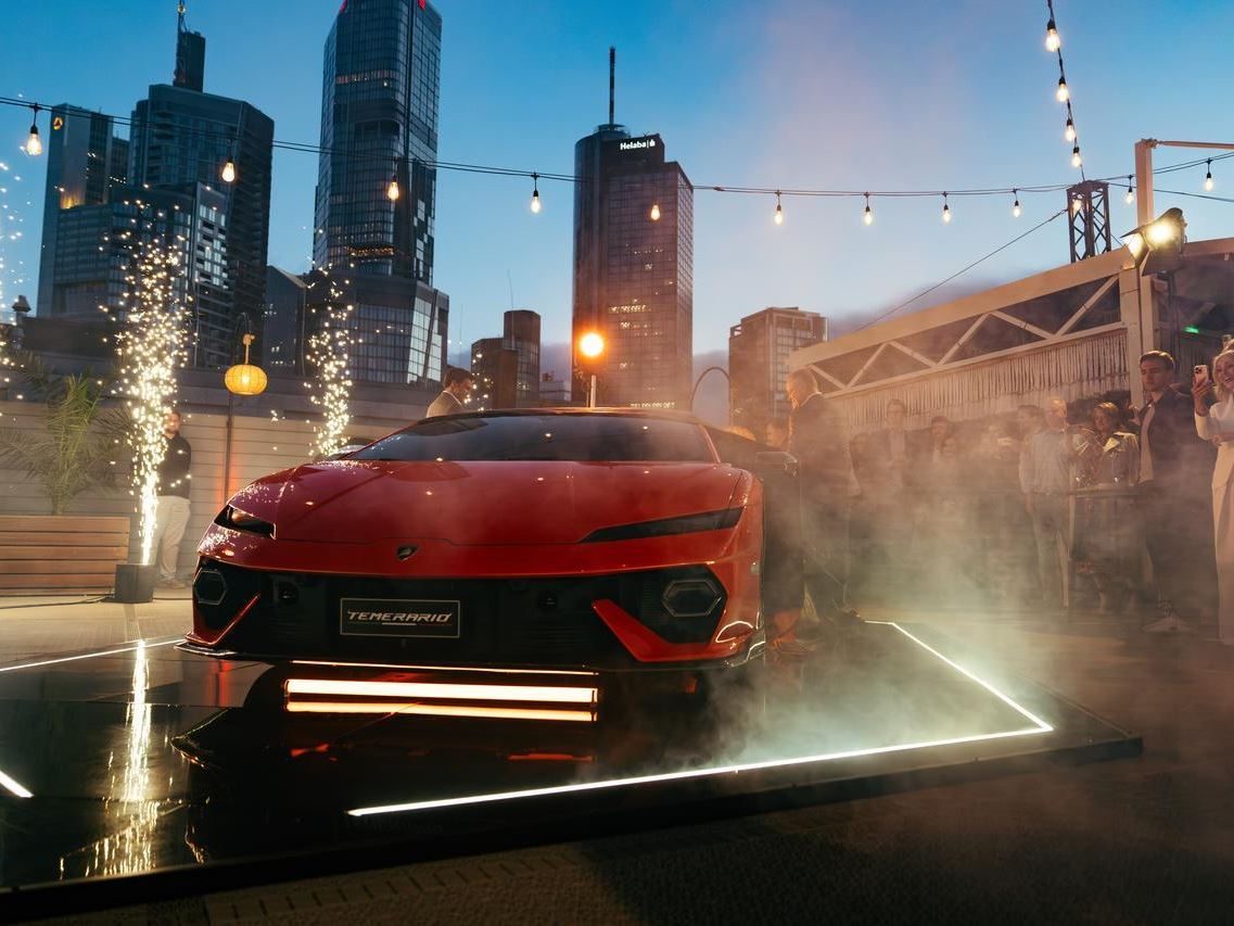 Lamborghini'S 4,000-Kilometer Temerario Tour Reveals How Seriously Sant'Agata Takes Germany 9 Lamborghini temerario unveiled at night on a rooftop surrounded by smoke, dramatic lighting, and a crowd of onlookers