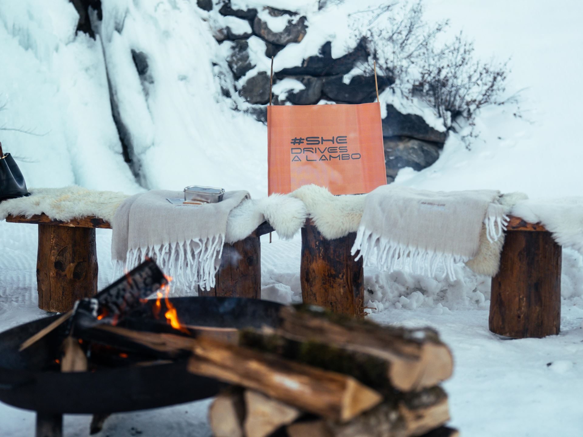 Lamborghini'S Temerario Drifts On Alpine Ice, Proving Its Hybrid System Works Where Grip Doesn'T 7 Outdoor fire pit setup with #shedrivesalambo sign in snowy alpine setting