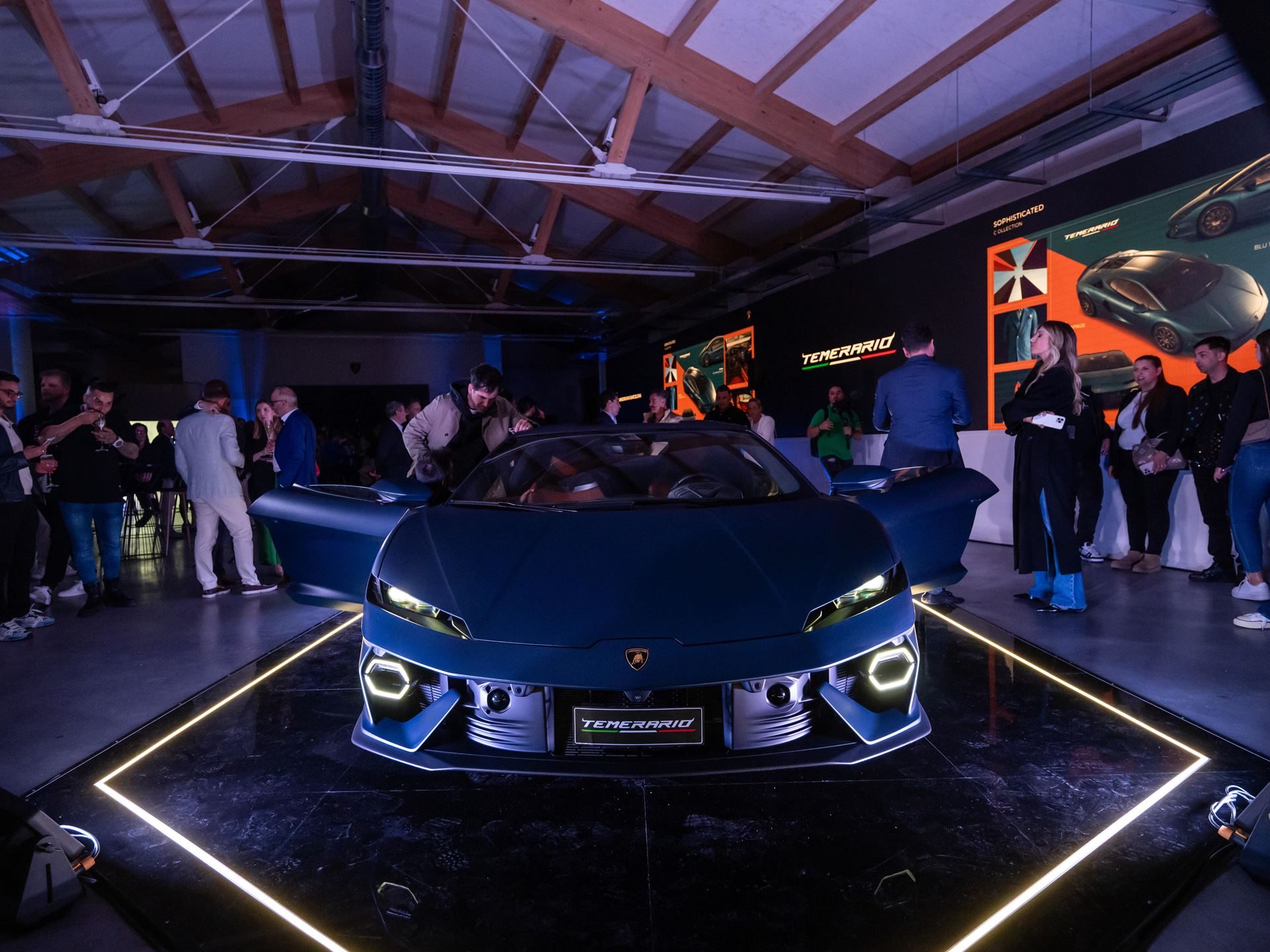 Lamborghini Temerario: A 10,000 Rpm V8 And Three Electric Motors Replace The Huracán 5 Front view of blue lamborghini temerario showing hexagonal led drls, aggressive front bumper, and sharp hood lines