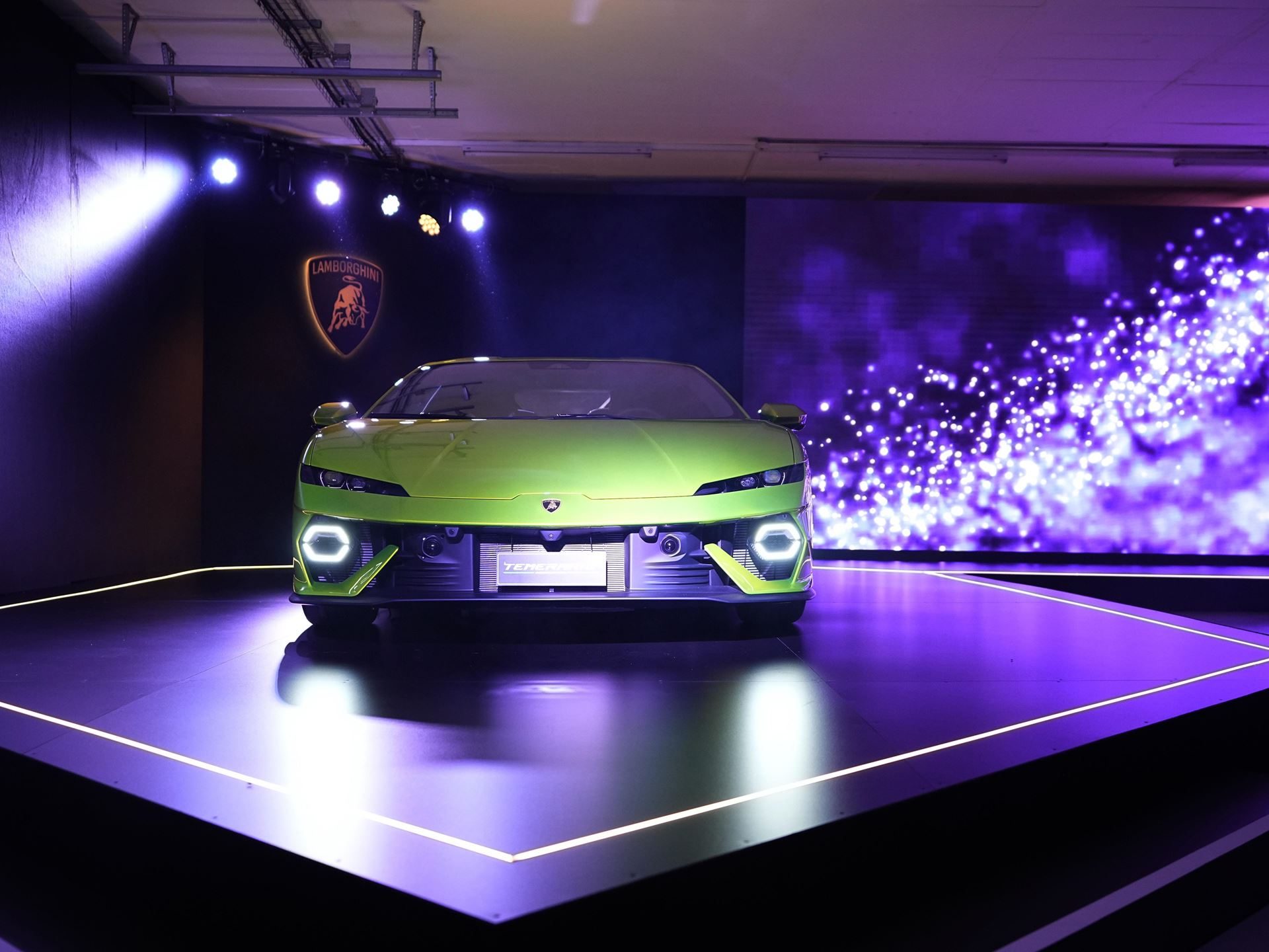 Lamborghini Temerario Arrives In Johannesburg With 920 Cv And A 10,000 Rpm V8 Hybrid 3 Head-on view of the lime green lamborghini temerario showing y-shaped drls and aggressive front fascia on stage