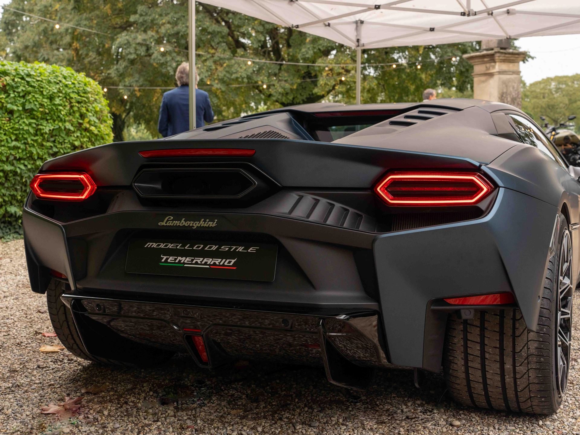 Rear three-quarter view of the matte dark grey lamborghini temerario style model showing hexagonal taillights and modello di stile temerario badge