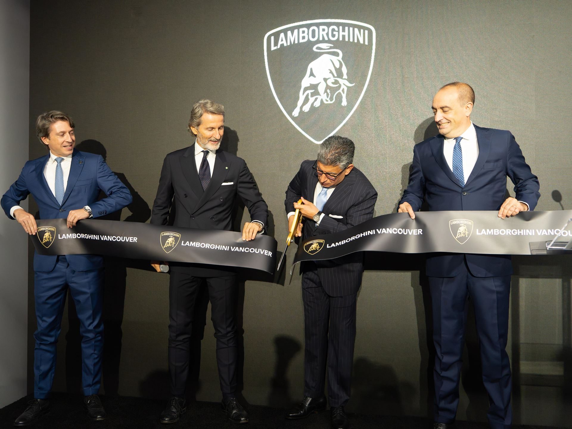 Lamborghini Vancouver'S Expanded Showroom Puts The Full Hybrid Lineup And Six Service Bays Under One Roof 3 Stephan winkelmann and executives cutting the ribbon at the lamborghini vancouver showroom opening