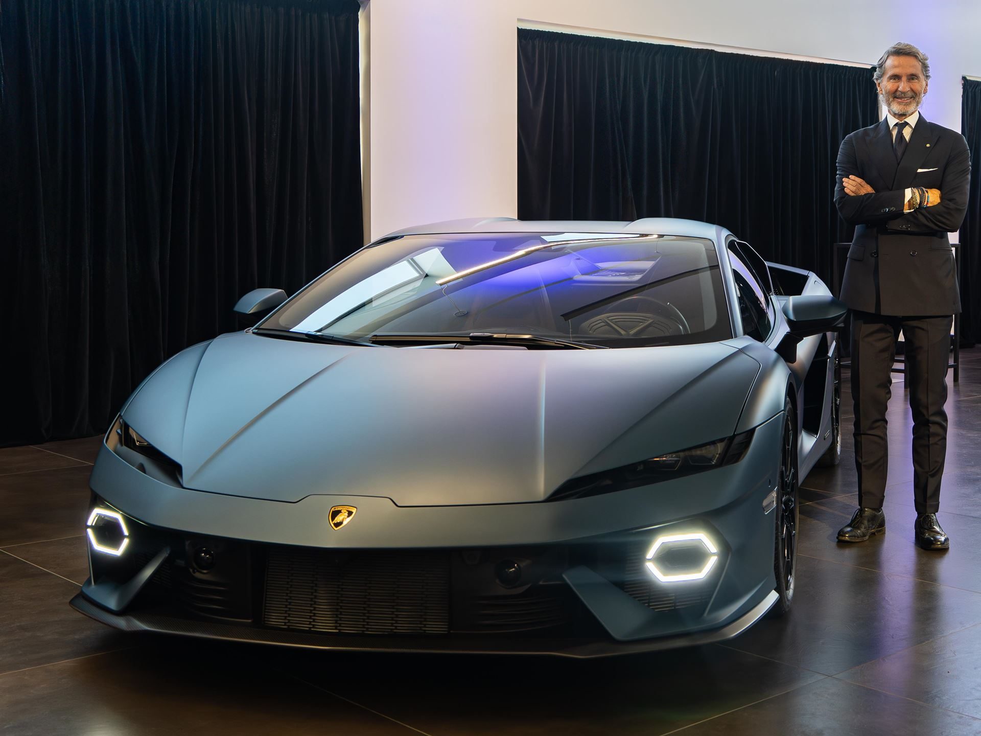 Lamborghini Vancouver'S Expanded Showroom Puts The Full Hybrid Lineup And Six Service Bays Under One Roof 11 Stephan winkelmann standing next to the matte blue lamborghini temerario at the vancouver showroom event
