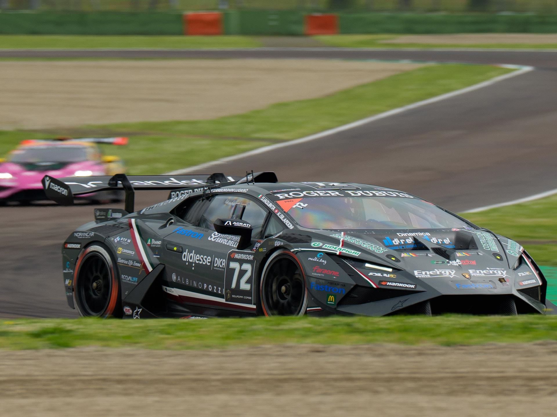 The grey #72 dl racing huracán super trofeo evo2 of championship leaders iaquinta and gilardoni navigates a turn at imola
