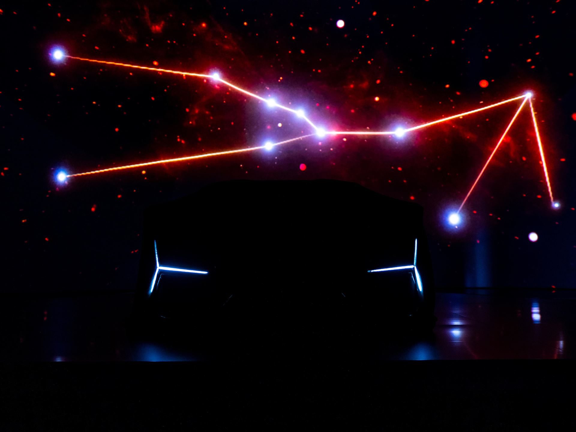480 Hours Of Hand-Painting: The Third Revuelto Opera Unica Targets China'S Collectors 9 Revuelto opera unica silhouetted against a backdrop displaying the taurus constellation in red and white lights
