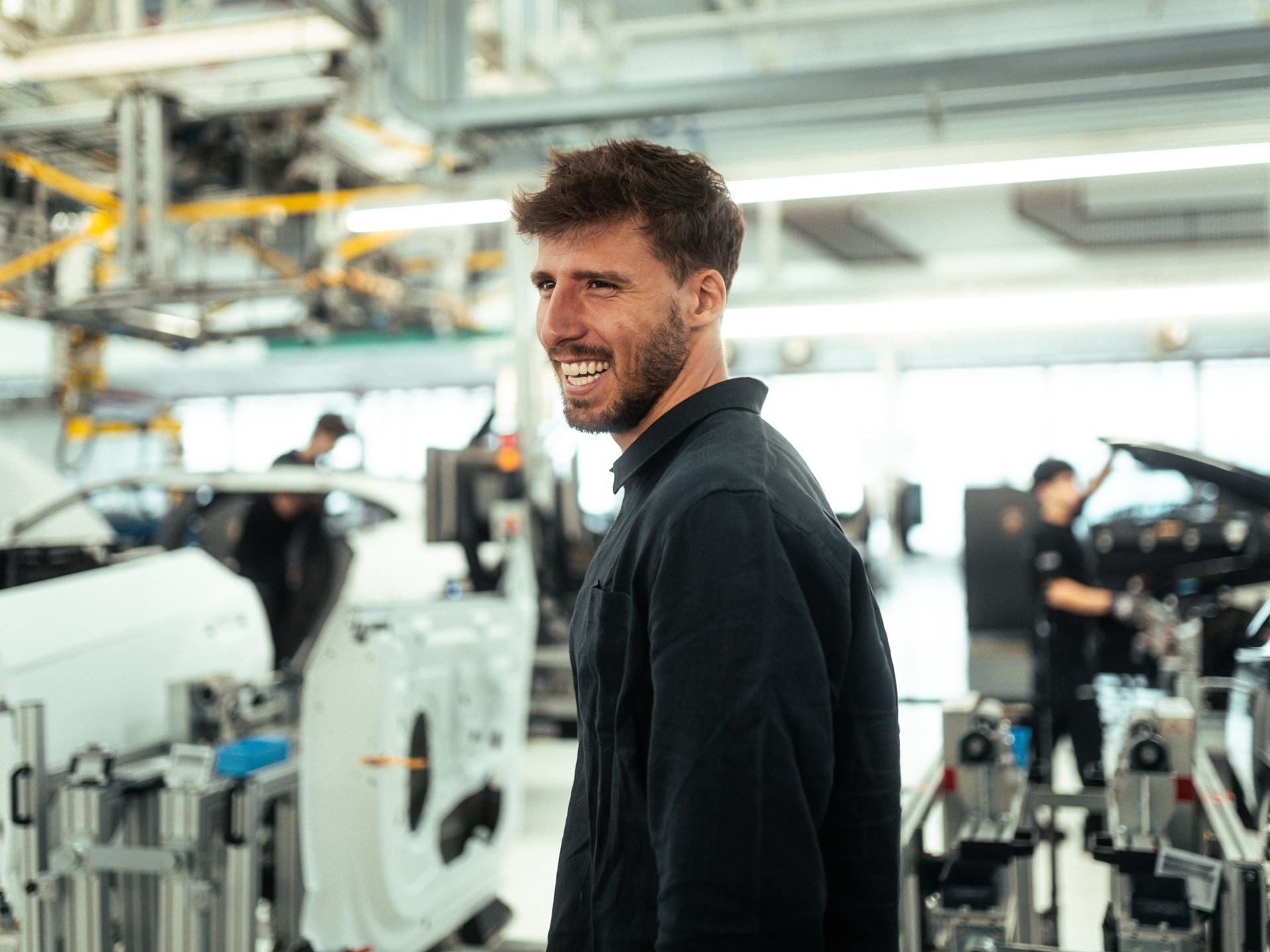 Lamborghini Taps Manchester City'S Rúben Dias To Front Its 1,001-Hp Flagship 7 Rúben dias smiling inside lamborghini's manufacturing facility with partially assembled cars in the background
