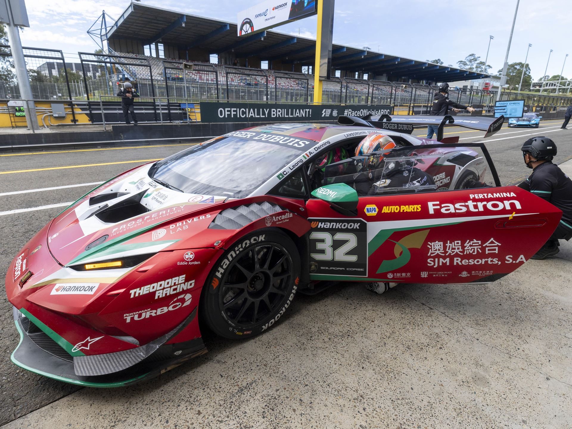 22 V10 Huracáns Descend On Shanghai As Super Trofeo Asia'S Class Battles Tighten 5 A lamborghini huracán super trofeo evo2 in italian-flag livery sits in the pit lane with door open, driver inside, and crew members attending