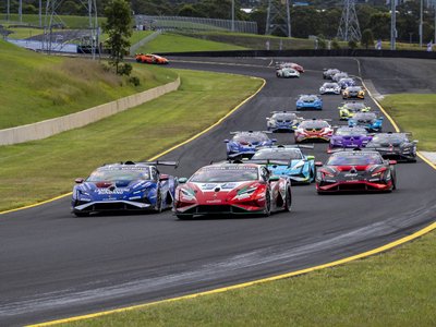 22 V10 Huracáns Descend On Shanghai As Super Trofeo Asia'S Class Battles Tighten 2 Multiple lamborghini huracán super trofeo evo2 race cars navigate a turn during a super trofeo asia round, showing aggressive aero kits and large rear wings
