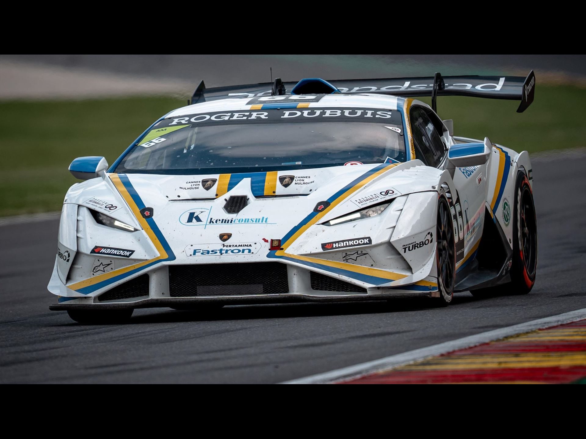 Every Super Trofeo Europe Title Still Up For Grabs As Nürburgring Kicks Off The Second Half 5 A white lamborghini huracán super trofeo evo2 with blue and yellow racing livery at speed on track