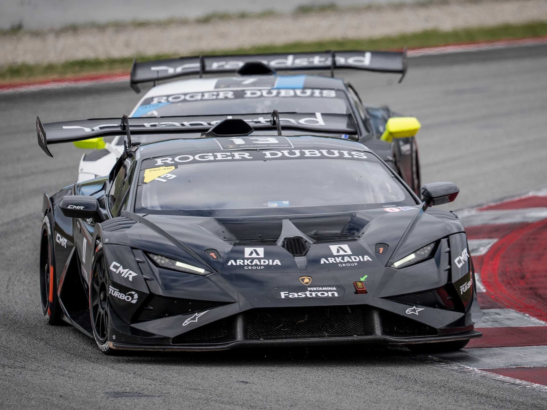 Cmr'S Dimitrov And Guerin Lock Up Super Trofeo Europe Pro-Am Title With A Round To Spare 3 A black lamborghini huracán super trofeo evo2 leads another car closely through a turn at barcelona