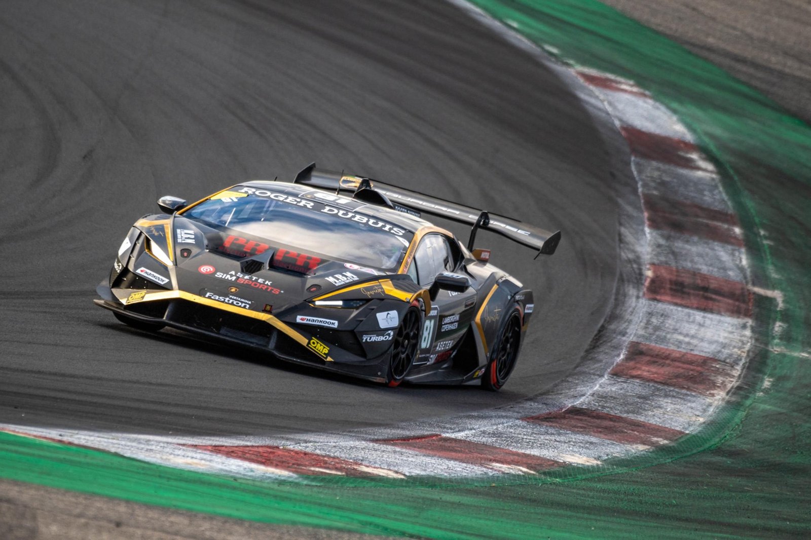 Black and gold Lamborghini Huracán Super Trofeo EVO2 race car cornering at Vallelunga during the 2023 World Finals