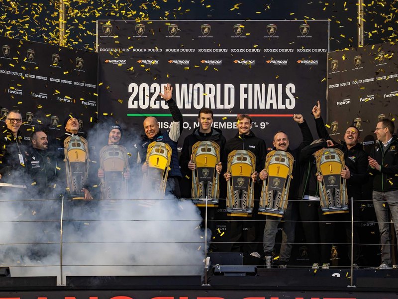 2025 Lamborghini World Finals champions celebrate on the podium at Misano with trophies and confetti