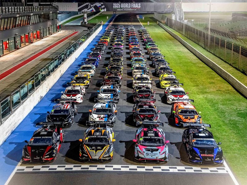 Lamborghini Huracán Super Trofeo EVO2 race cars lined up under lights at the 2025 World Finals at Misano