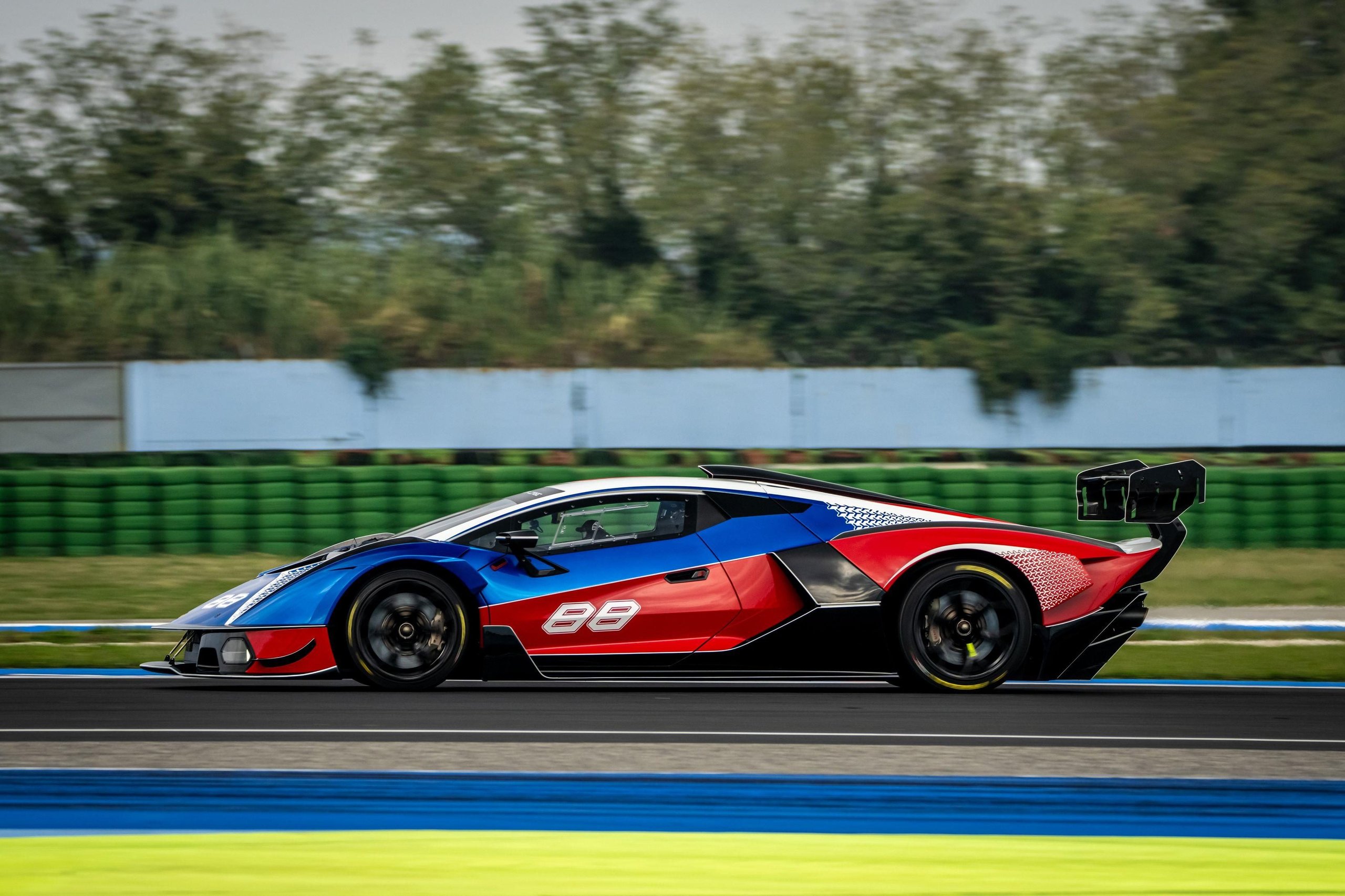 Four Weekends, 40 Cars, Factory Drivers: Inside Lamborghini'S 2026 Essenza Scv12 Program 5 Multi-colored lamborghini essenza scv12 at speed on track showing distinctive racing livery and aerodynamic profile