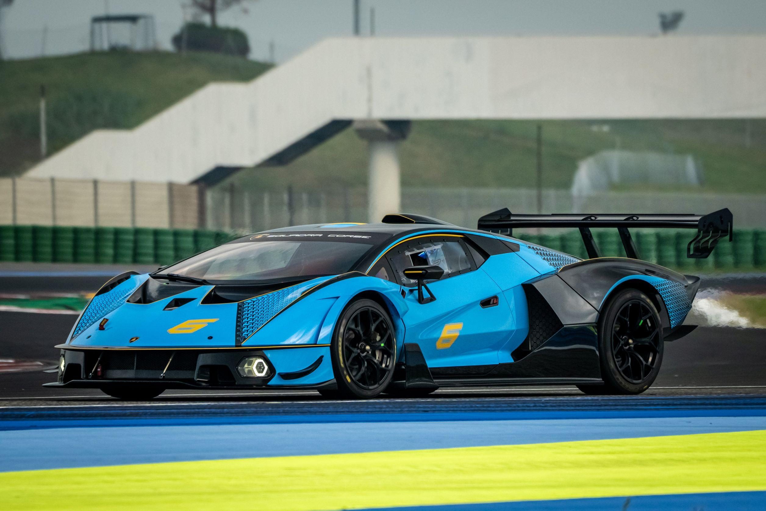 Four Weekends, 40 Cars, Factory Drivers: Inside Lamborghini'S 2026 Essenza Scv12 Program 11 Blue and black lamborghini essenza scv12 in motion on track viewed from the side showing aggressive side skirts and rear wing