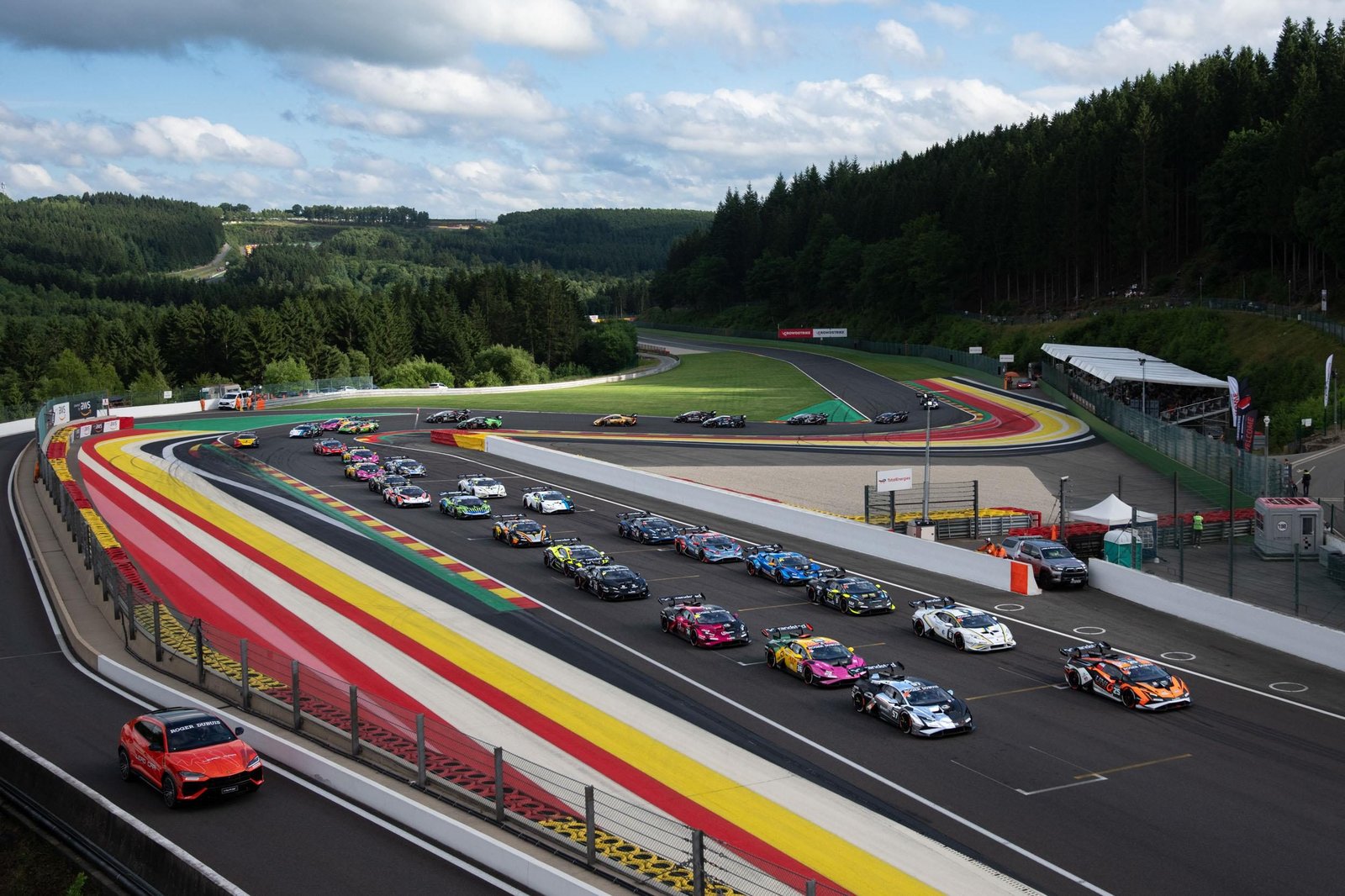 Aerial view of a full grid of Lamborghini Huracán Super Trofeo EVO2 race cars lined up on the starting grid of a race track