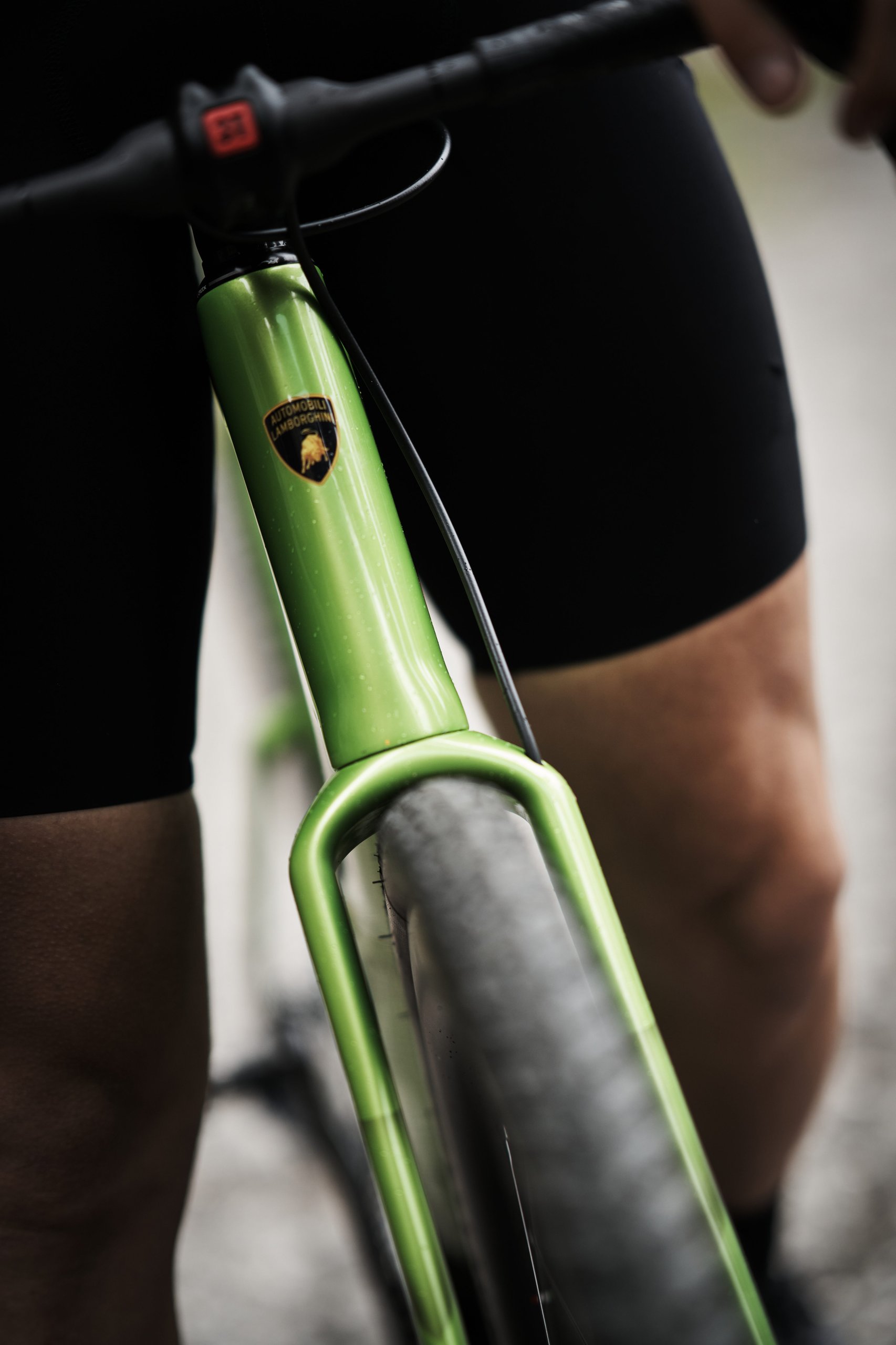 Lamborghini'S Centro Stile Designed Two New 3T Bicycles, And They Cost Less Than A Set Of Revuelto Brake Pads 3 Close-up of the green 3t racemax x automobili lamborghini head tube showing the iconic lamborghini shield logo on carbon fiber