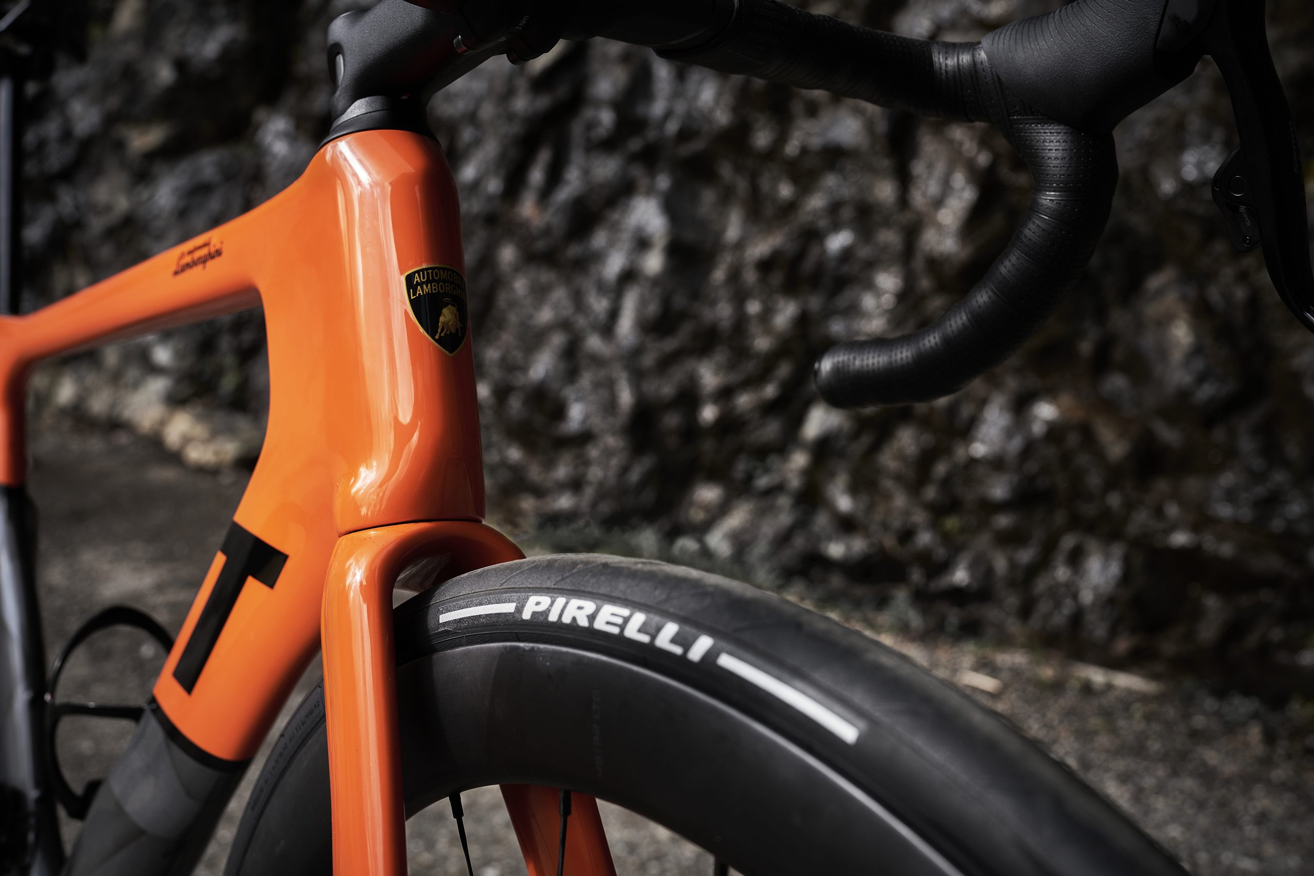 Lamborghini'S Centro Stile Designed Two New 3T Bicycles, And They Cost Less Than A Set Of Revuelto Brake Pads 5 Close-up detail of the orange arancio apodis 3t x automobili lamborghini bicycle frame showing the lamborghini shield logo and carbon fiber construction