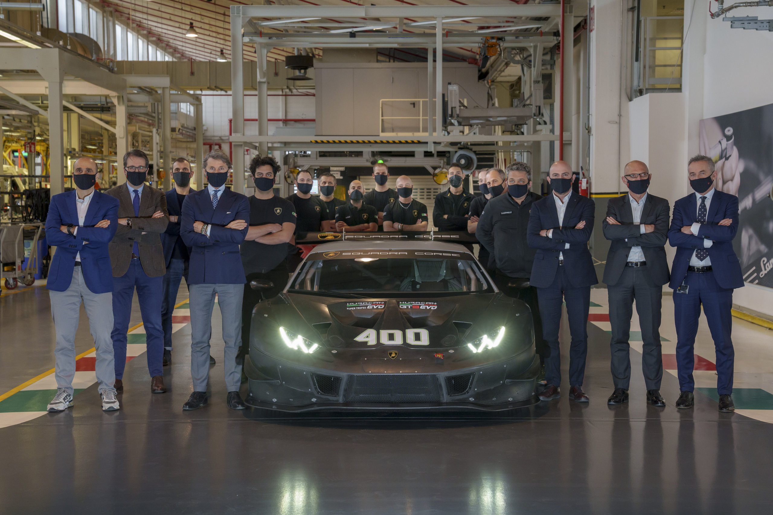 400 Huracán Race Cars, One Factory Floor: How Lamborghini'S Shared Production Line Built A Gt Dynasty 3 Lamborghini executives and technicians pose with the 400th huracán gt3 evo inside the sant'agata bolognese factory, with the number 400 displayed on the car