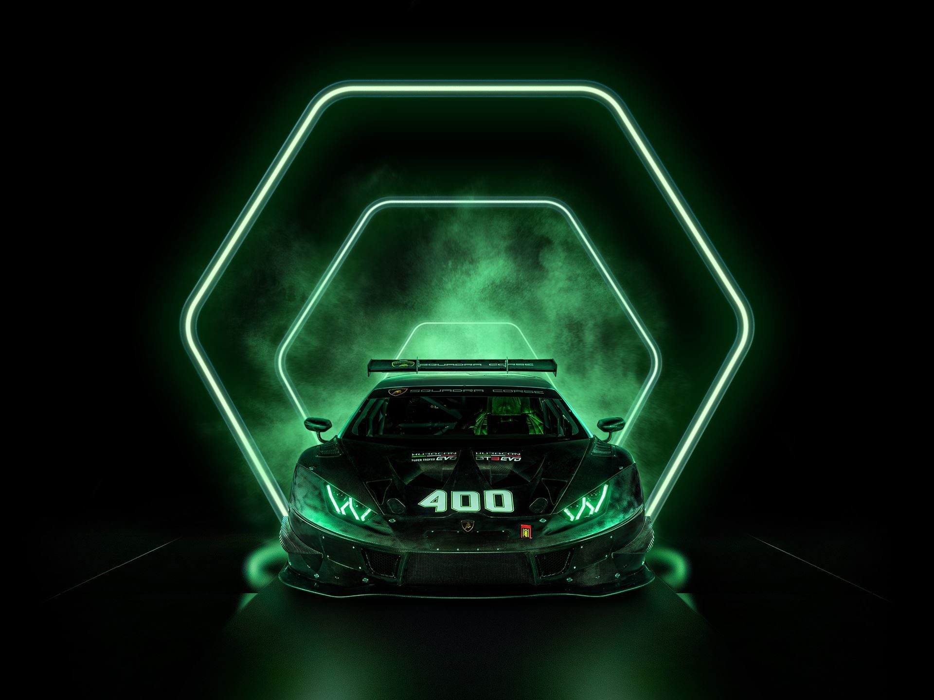 400 Huracán Race Cars, One Factory Floor: How Lamborghini'S Shared Production Line Built A Gt Dynasty 7 Lamborghini huracán gt3 evo in a dark studio illuminated by green neon hexagonal lighting, highlighting the car's aggressive aerodynamic profile