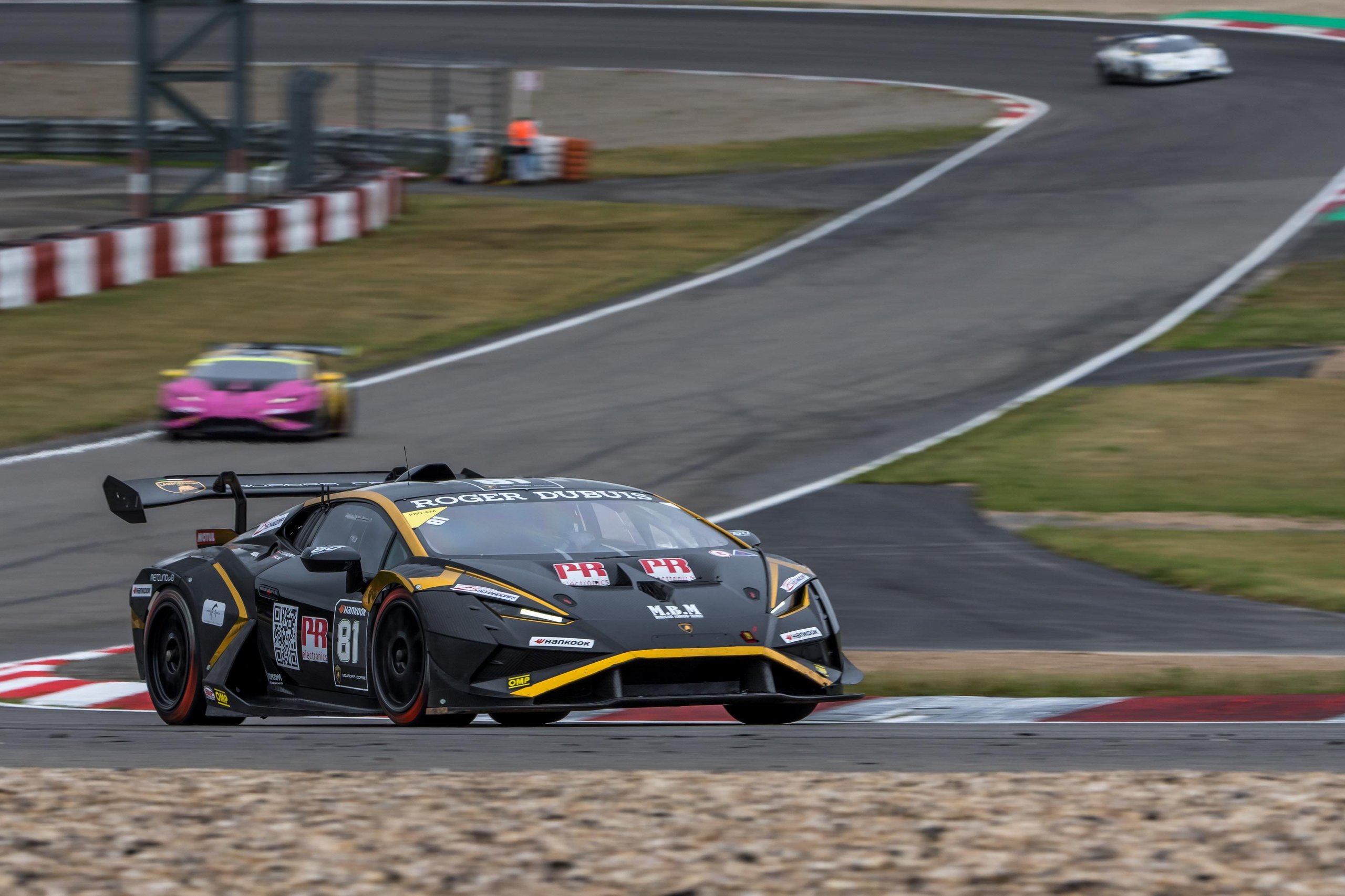 A 17-Year-Old Egyptian Just Rewrote The Record Books At Nürburgring'S Super Trofeo Europe Round 5 A black and yellow lamborghini huracán super trofeo evo2 navigates a turn at the nürburgring with competitors visible behind