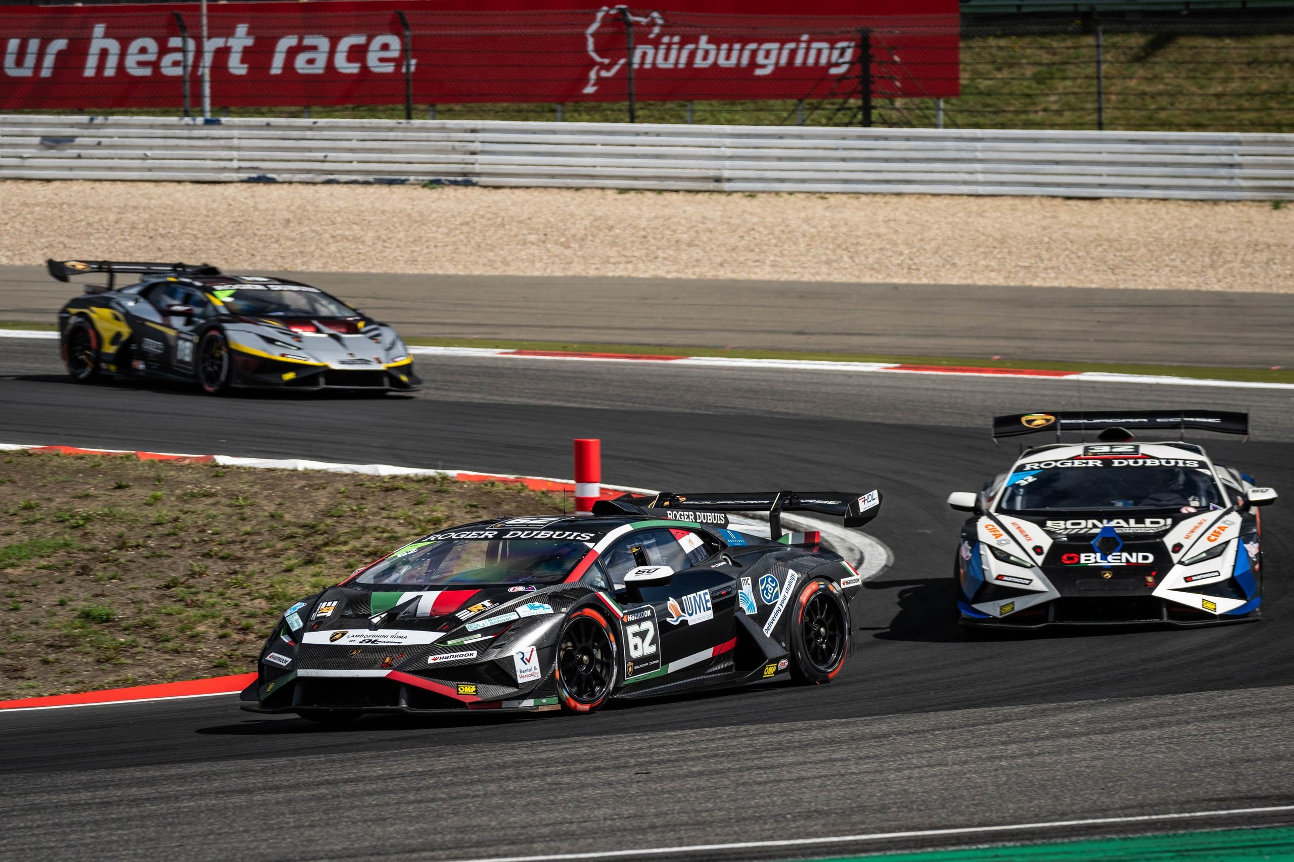 A 17-Year-Old Egyptian Just Rewrote The Record Books At Nürburgring'S Super Trofeo Europe Round 11 Three lamborghini huracán super trofeo evo2 cars in black/green, white/blue, and grey/yellow liveries navigate a nürburgring corner