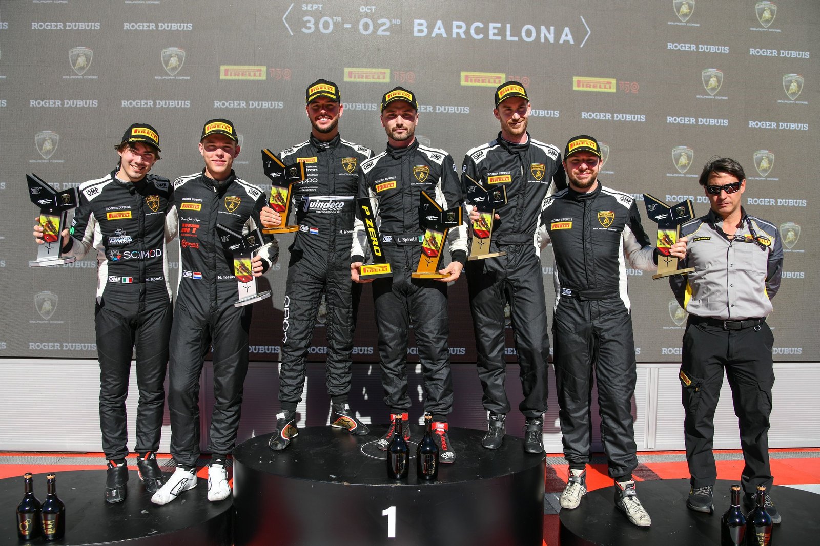 Bonaldi Motorsport drivers celebrate on the podium with trophies and champagne at the Barcelona Super Trofeo Europe round
