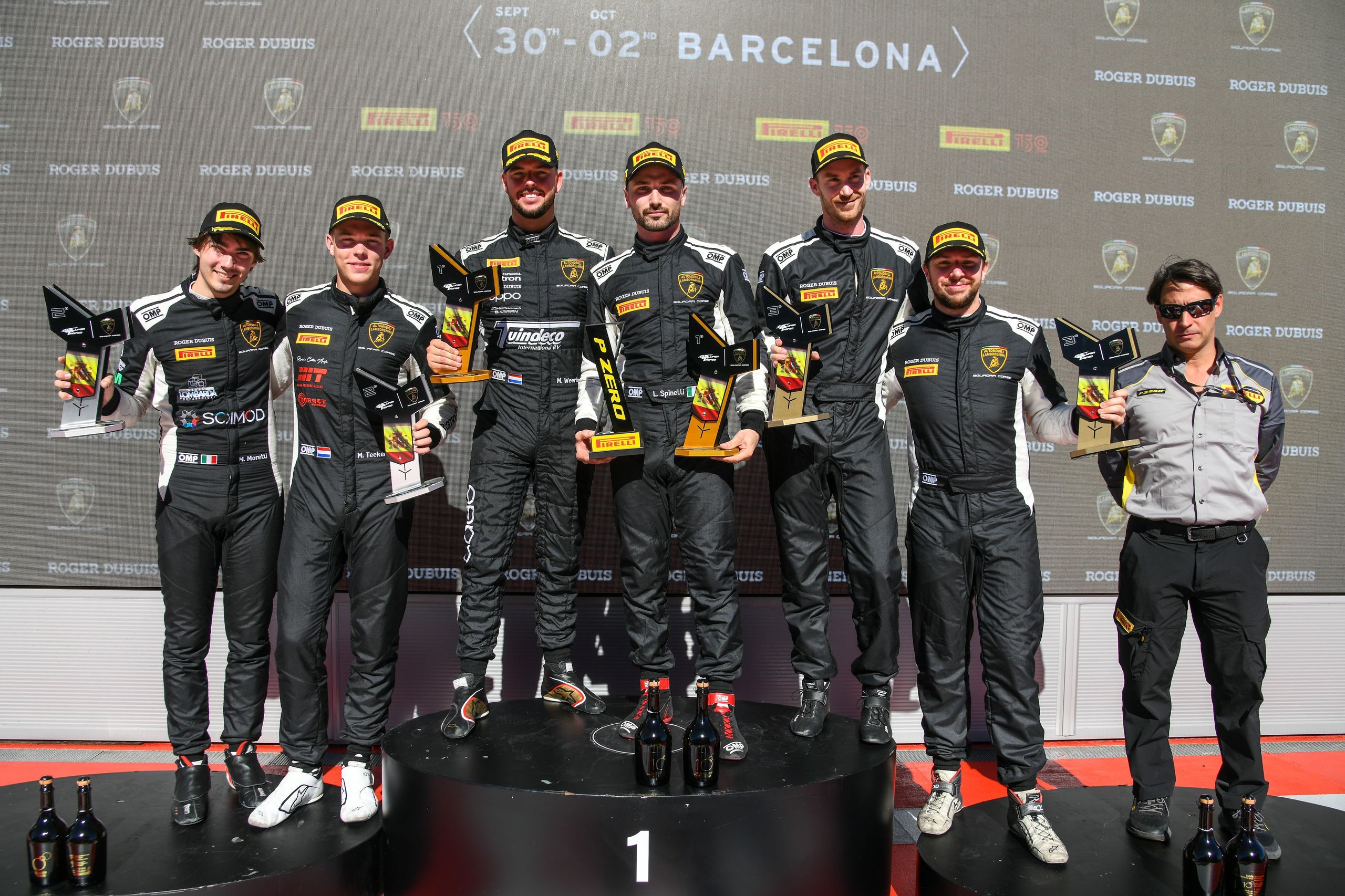 How Bonaldi Motorsport Turned A Botched Rival Pit Stop Into A Barcelona Title Sweep 11 Bonaldi motorsport drivers celebrate on the podium with trophies and champagne at the barcelona super trofeo europe round