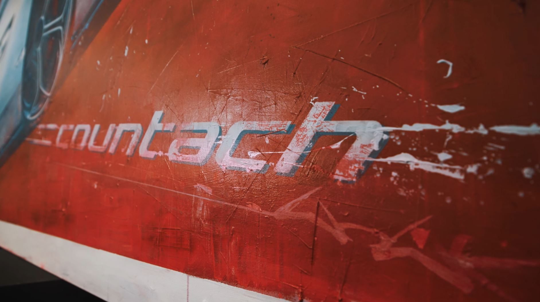 Lamborghini Turns Countach Lpi 800-4 Ownership Into A Numbered Art Collection 3 Close-up of the countach lettering on the artistic rendering showing textured paint and dynamic background