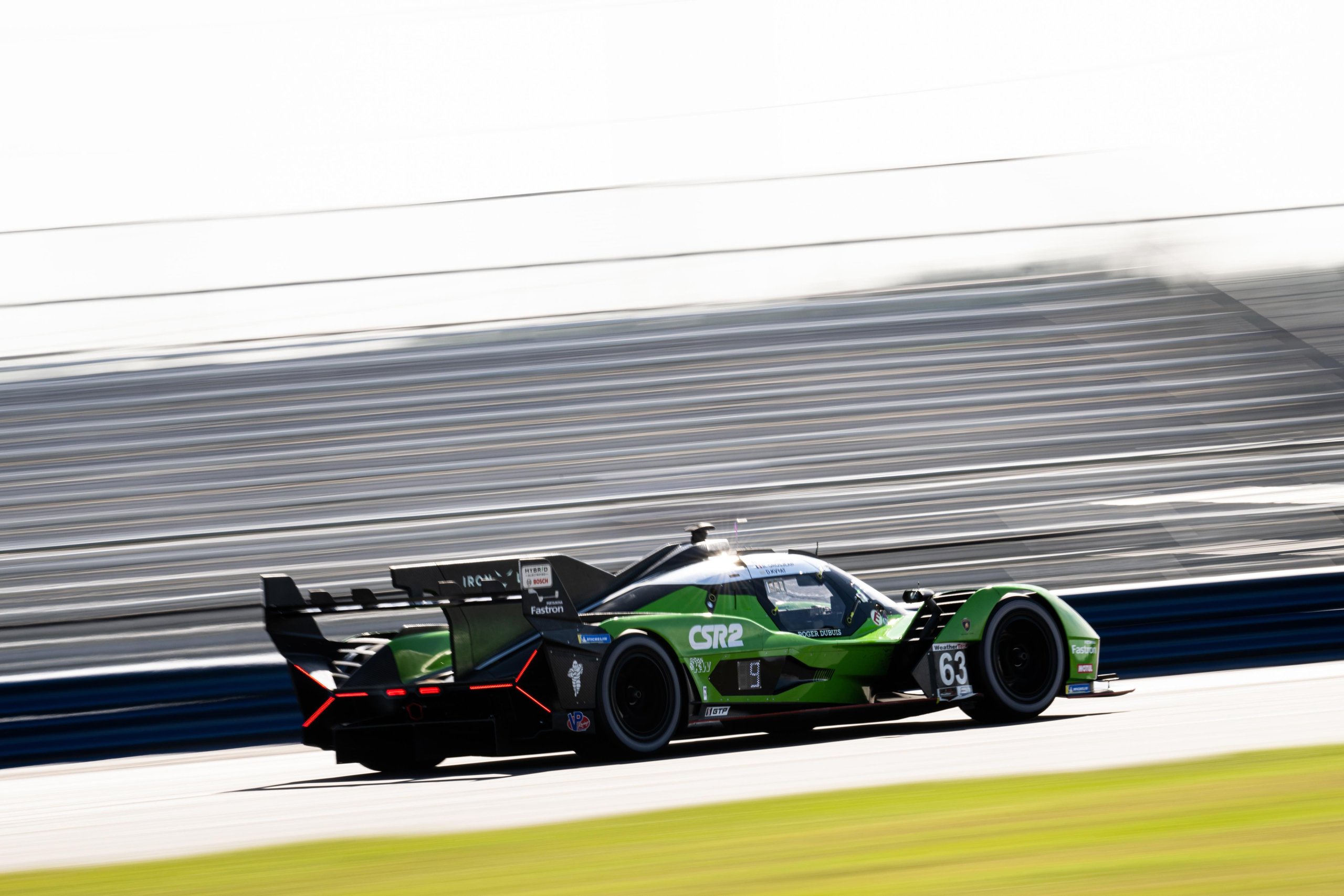Lamborghini'S Sc63 Lands In Csr Racing 2, And The Real Strategy Goes Deeper Than Pixels 5 Rear-side angle of green lamborghini sc63 number 63 on track with motion blur showing rear wing and diffuser