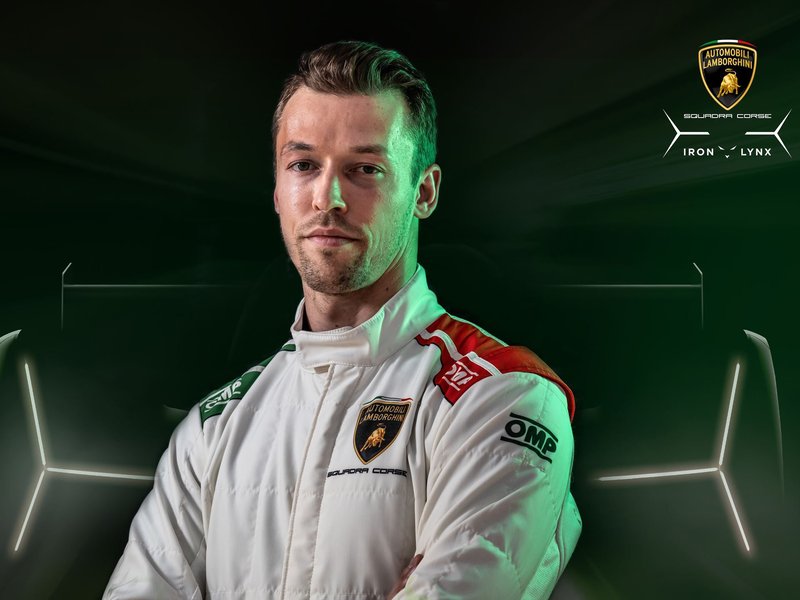 Daniil Kvyat in Lamborghini Squadra Corse racing suit with SC63 silhouette in background