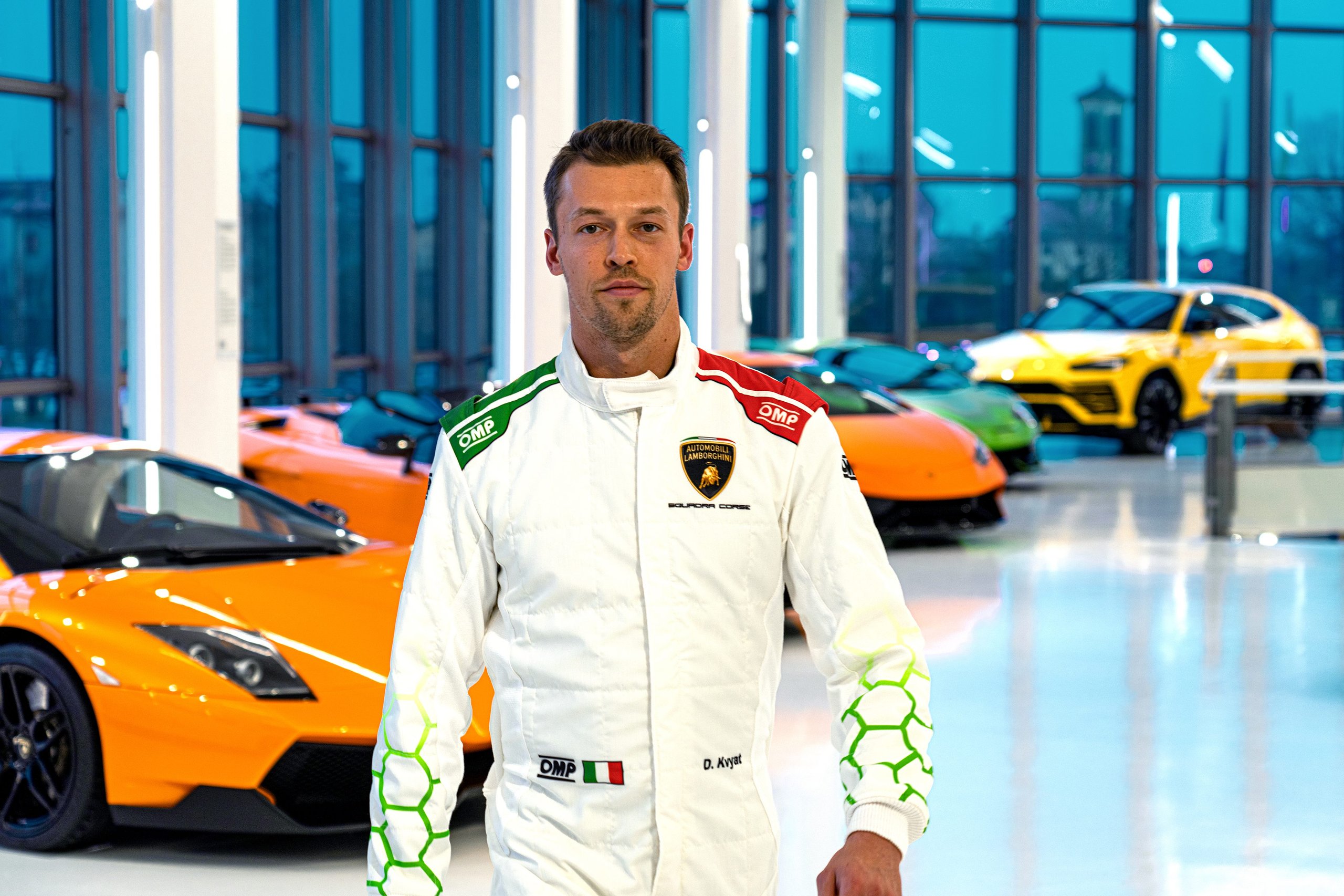 Kvyat'S F1 Pedigree Becomes Lamborghini'S Lmdh Development Weapon 7 Close-up portrait of daniil kvyat in lamborghini racing suit with blurred showroom background