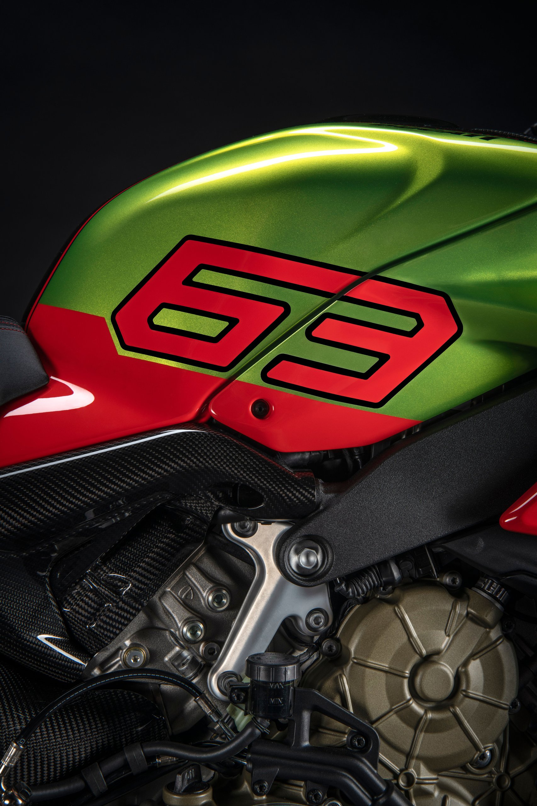 The Ducati Streetfighter V4 Lamborghini Puts The Huracán Sto In Your Garage On Two Wheels 7 Close-up of the side fairing showing the prominent 63 graphic in green and orange with visible carbon fiber elements and exposed engine components