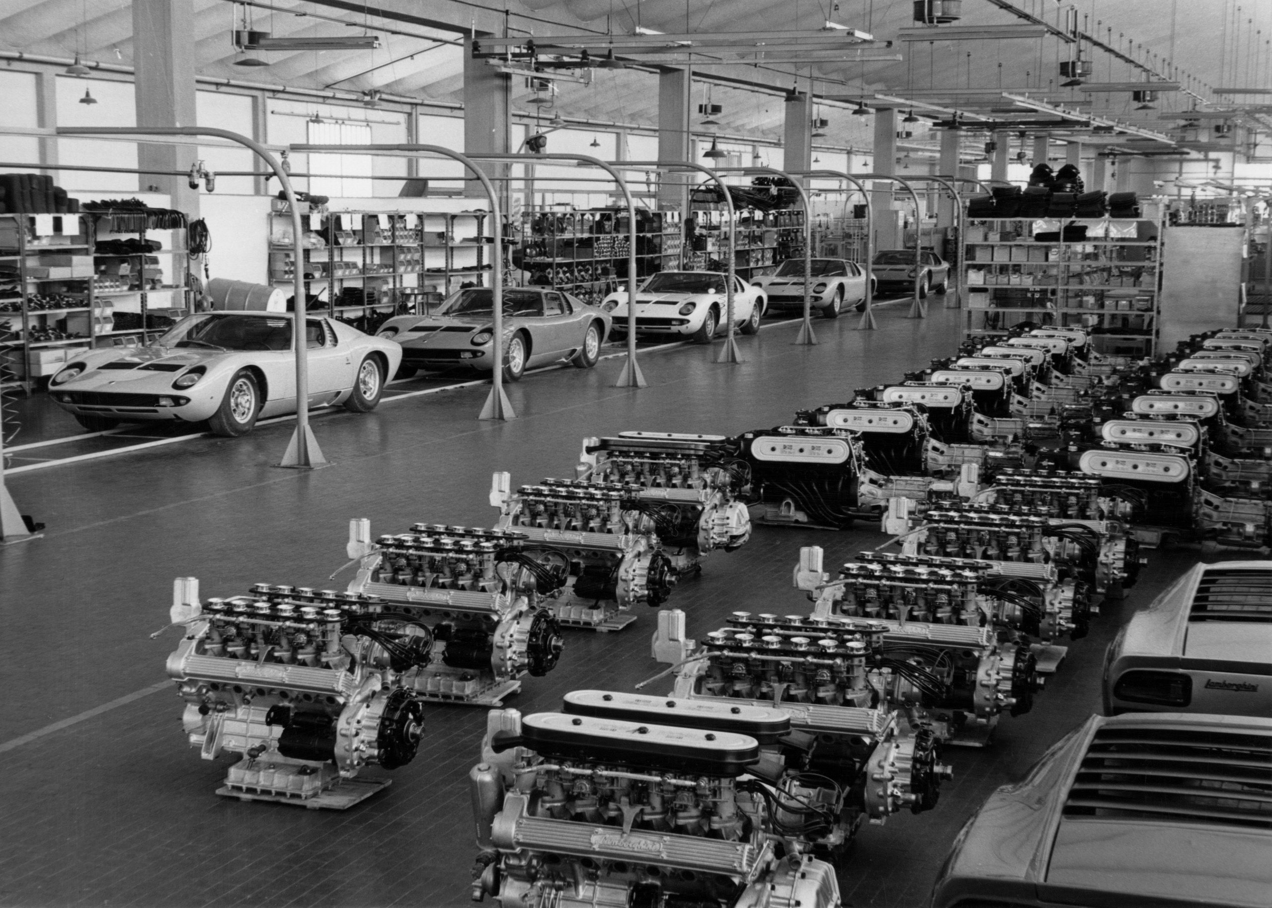 Ferruccio Lamborghini At 105: How A Stubborn Tractor Builder'S Grudge Created An Automotive Dynasty 11 Black and white image of the lamborghini assembly line showing multiple miura chassis and v12 engines awaiting installation