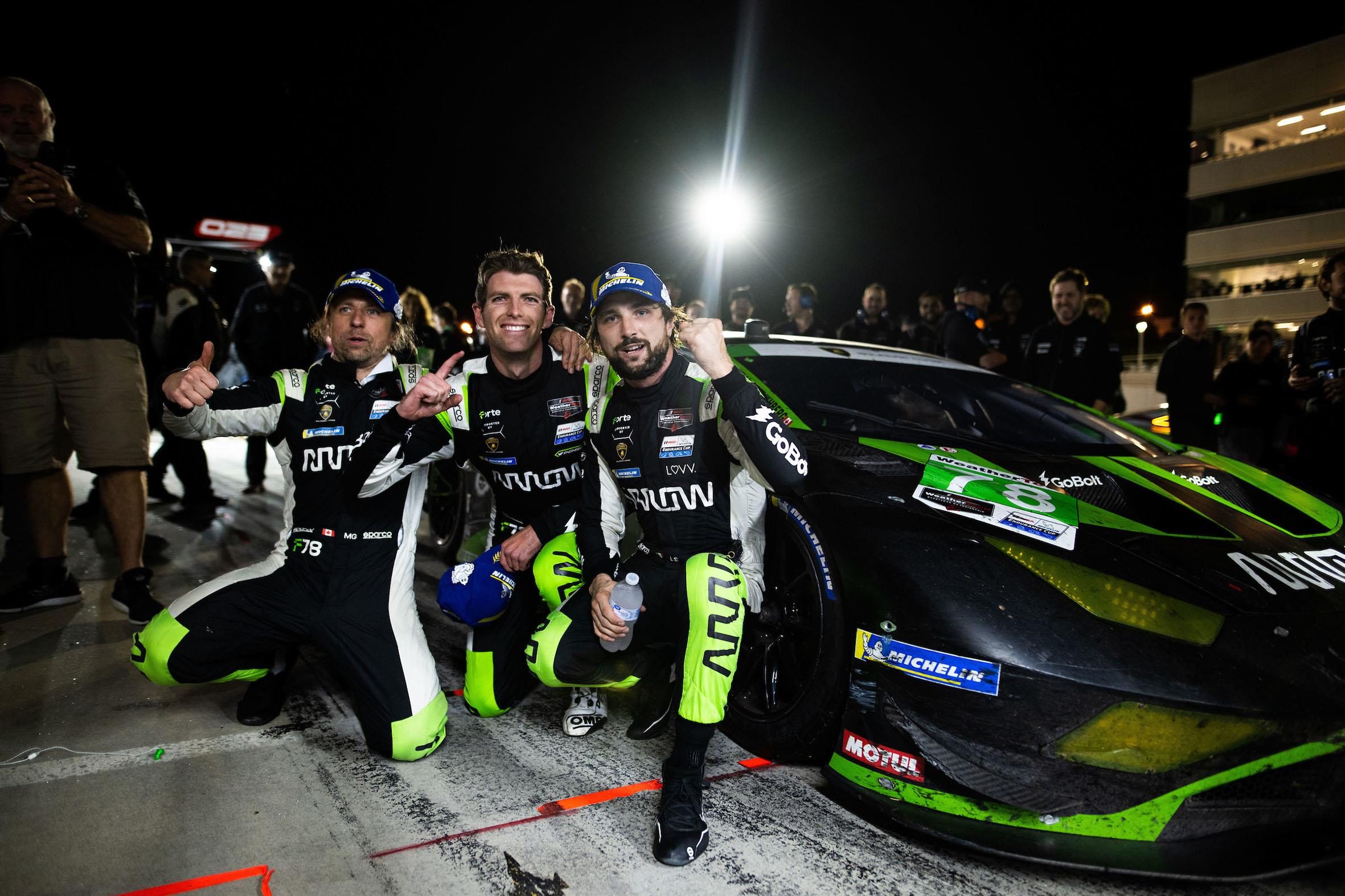 Three Penalties, One Win: How Forte Racing'S Petit Le Mans Comeback Validates Lamborghini'S Customer Racing Pipeline 5 Forte racing drivers pose triumphantly next to their lamborghini huracán gt3 evo2 in the pit lane at night after winning petit le mans