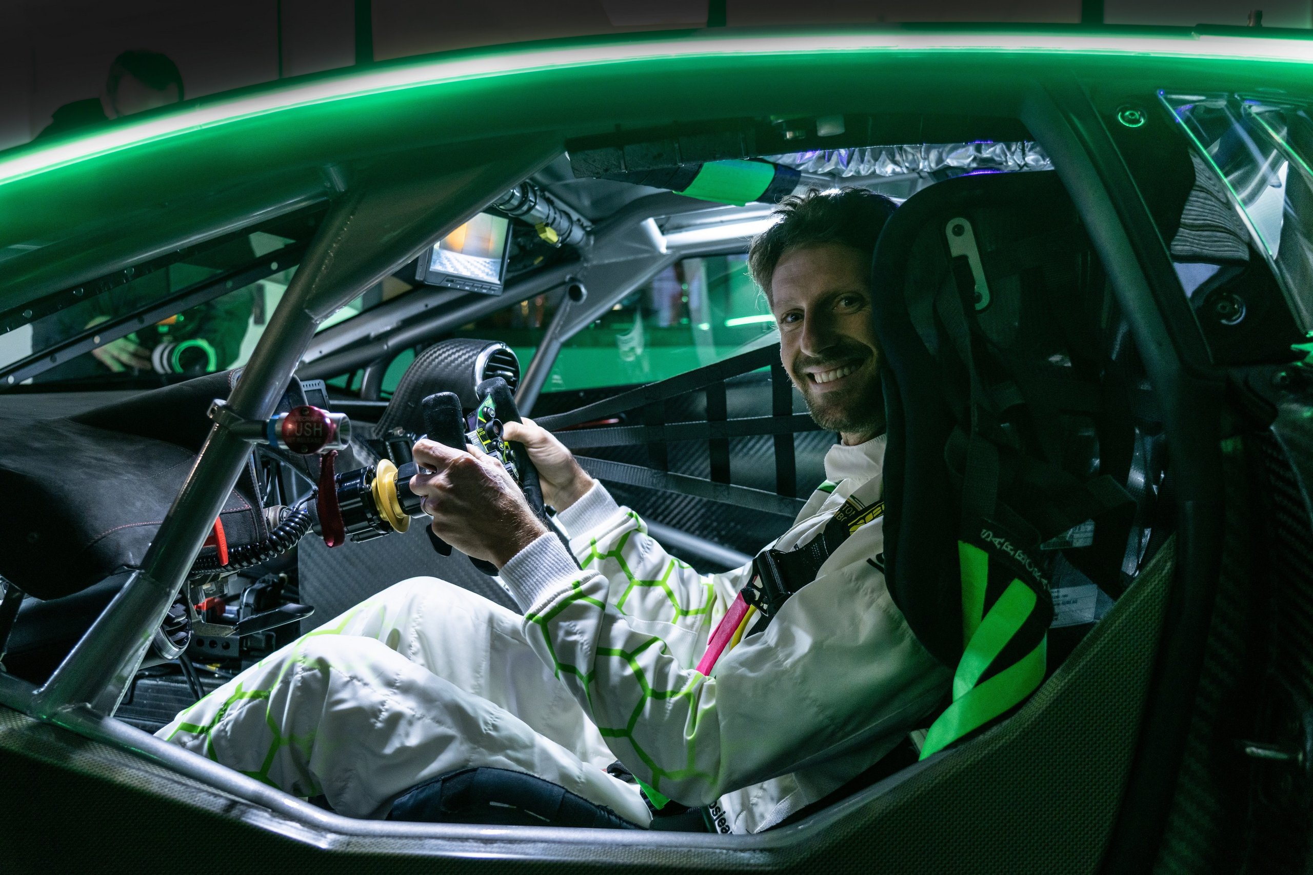 Why Lamborghini Hired An F1 Veteran To Build Its Hypercar Racing Future 3 Romain grosjean seated in the cockpit of the lamborghini sc63 lmdh car, hands on the steering wheel