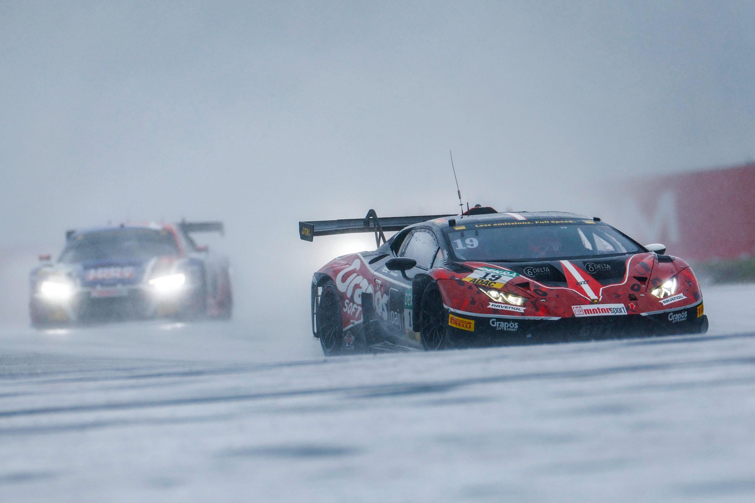 150 Gt3 Wins In Ten Years: How The Huracán Built Lamborghini'S Racing Credibility 5 Red and black lamborghini huracán gt3 evo2 number 19 racing on a wet nürburgring track with spray