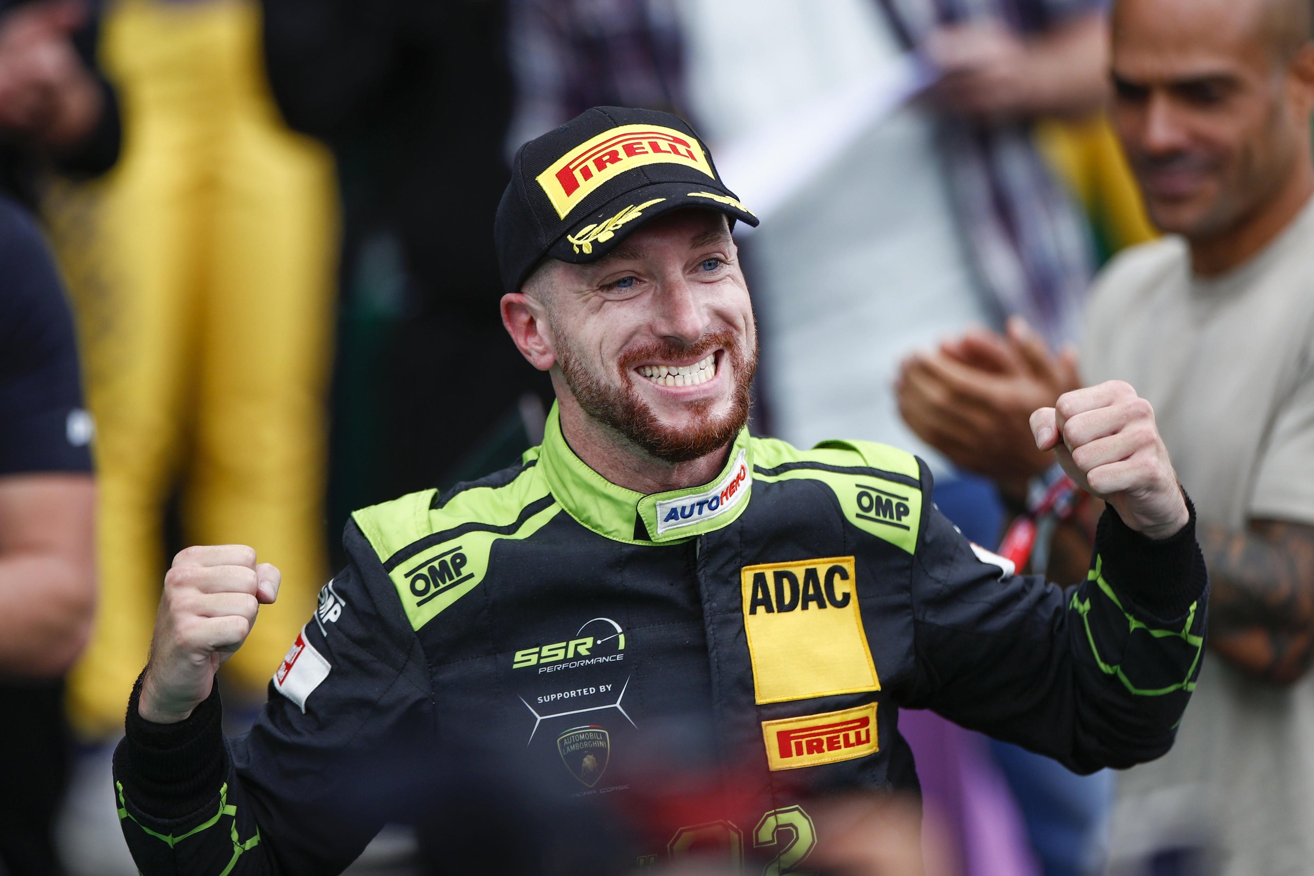 150 Gt3 Wins In Ten Years: How The Huracán Built Lamborghini'S Racing Credibility 3 Mirko bortolotti celebrating his maiden dtm victory in lamborghini racing suit and pirelli cap