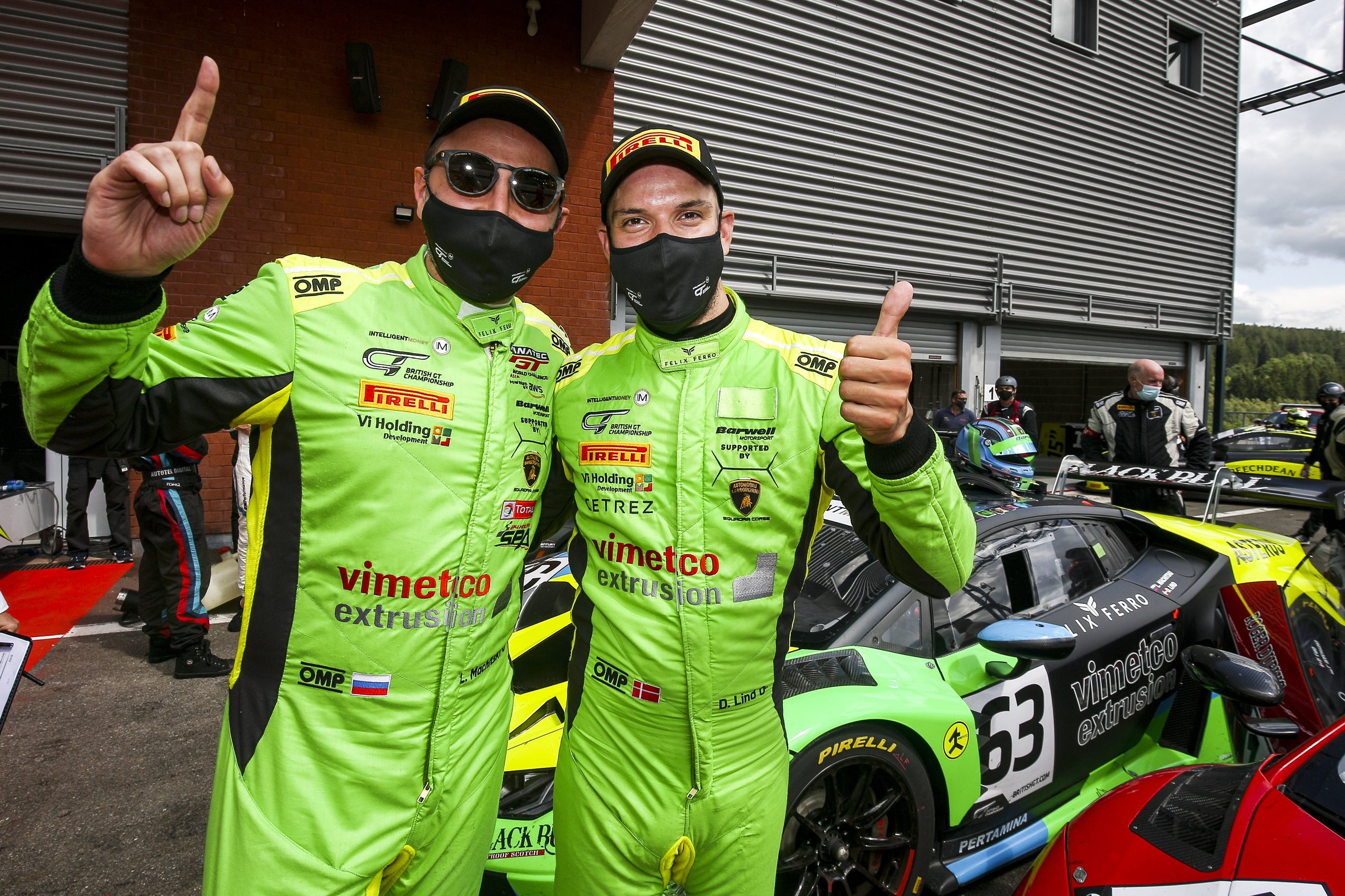 Huracán Gt3 Evo Locks Out The Top Two At Spa, And The 48-Second Margin Tells The Real Story 5 Dennis lind and leo machitski in green racing suits posing with the #63 huracán gt3 evo in the pit lane