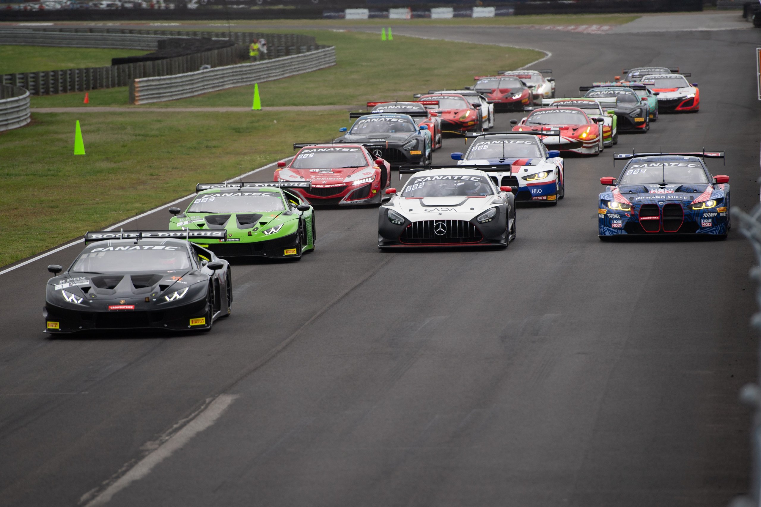K-Pax Racing'S Nola Sweep Proves The Huracán Gt3 Evo Remains The Car To Beat In American Gt Racing 5 A pack of gt3 race cars including two lamborghini huracán gt3 evos racing alongside mercedes and bmw competitors at nola motorsports park