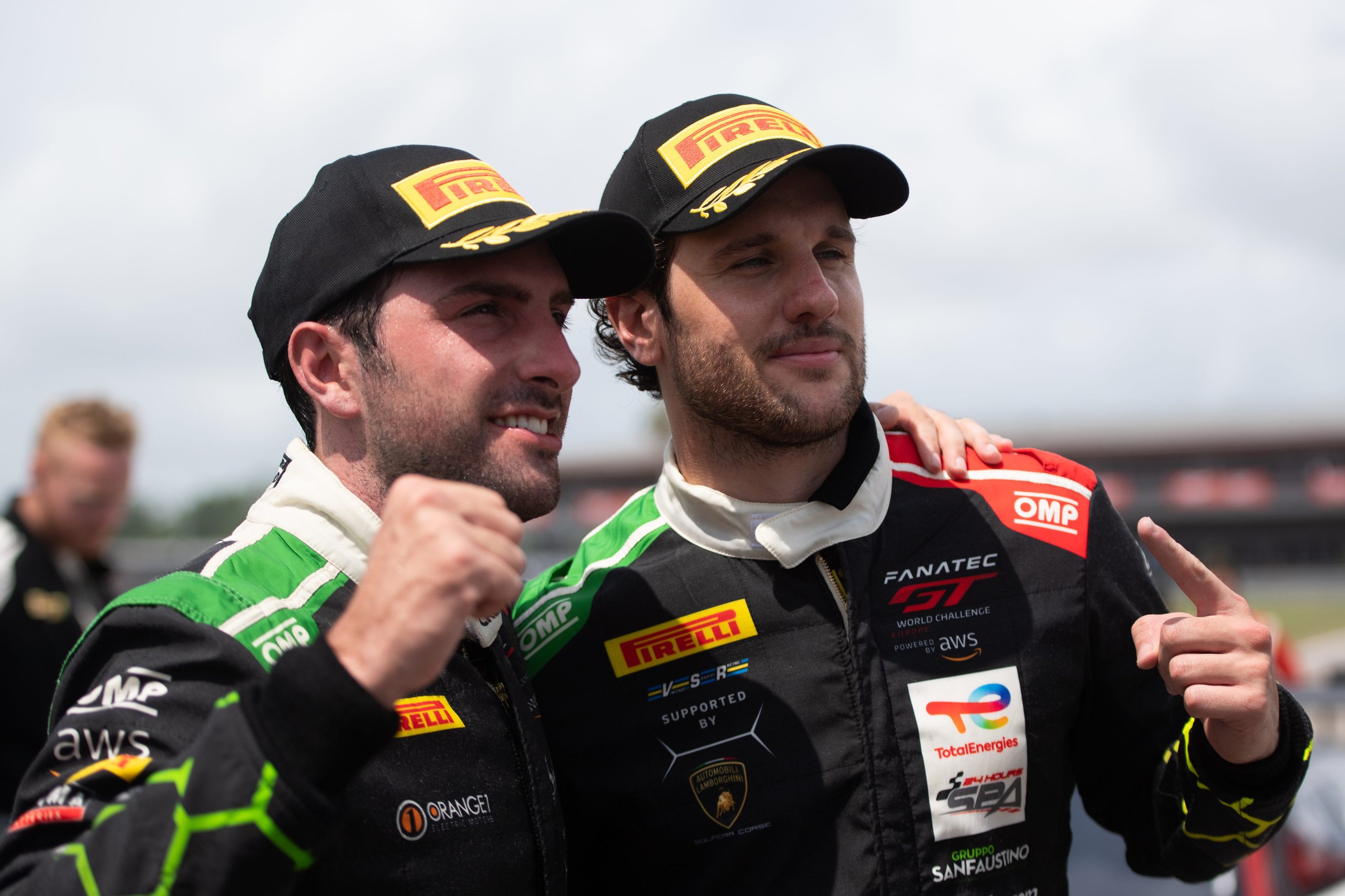 K-Pax Racing'S Nola Sweep Proves The Huracán Gt3 Evo Remains The Car To Beat In American Gt Racing 7 Andrea caldarelli and michele beretta celebrating on the nola motorsports park circuit in racing suits with lamborghini squadra corse and pirelli branding