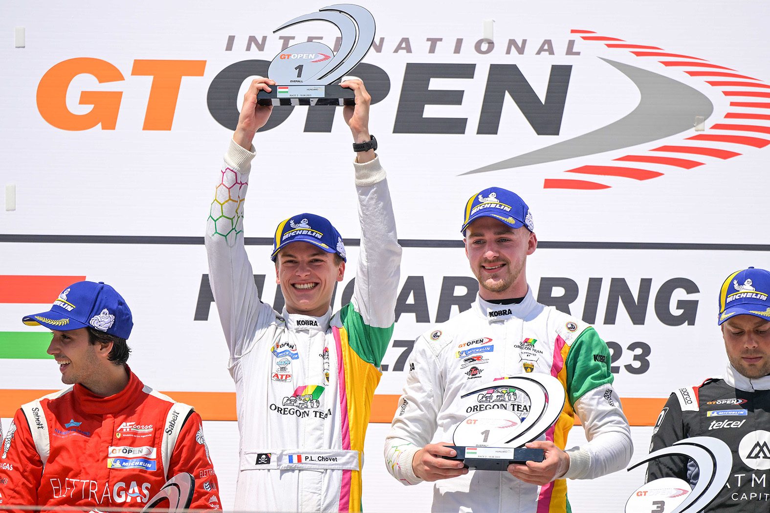 Two-Tenths Of A Second: How The Huracán Gt3 Evo2 Keeps Winning Before The Temerario Takes Over 7 Maximilian paul and pierre-louis chovet celebrating on the international gt open podium holding trophies