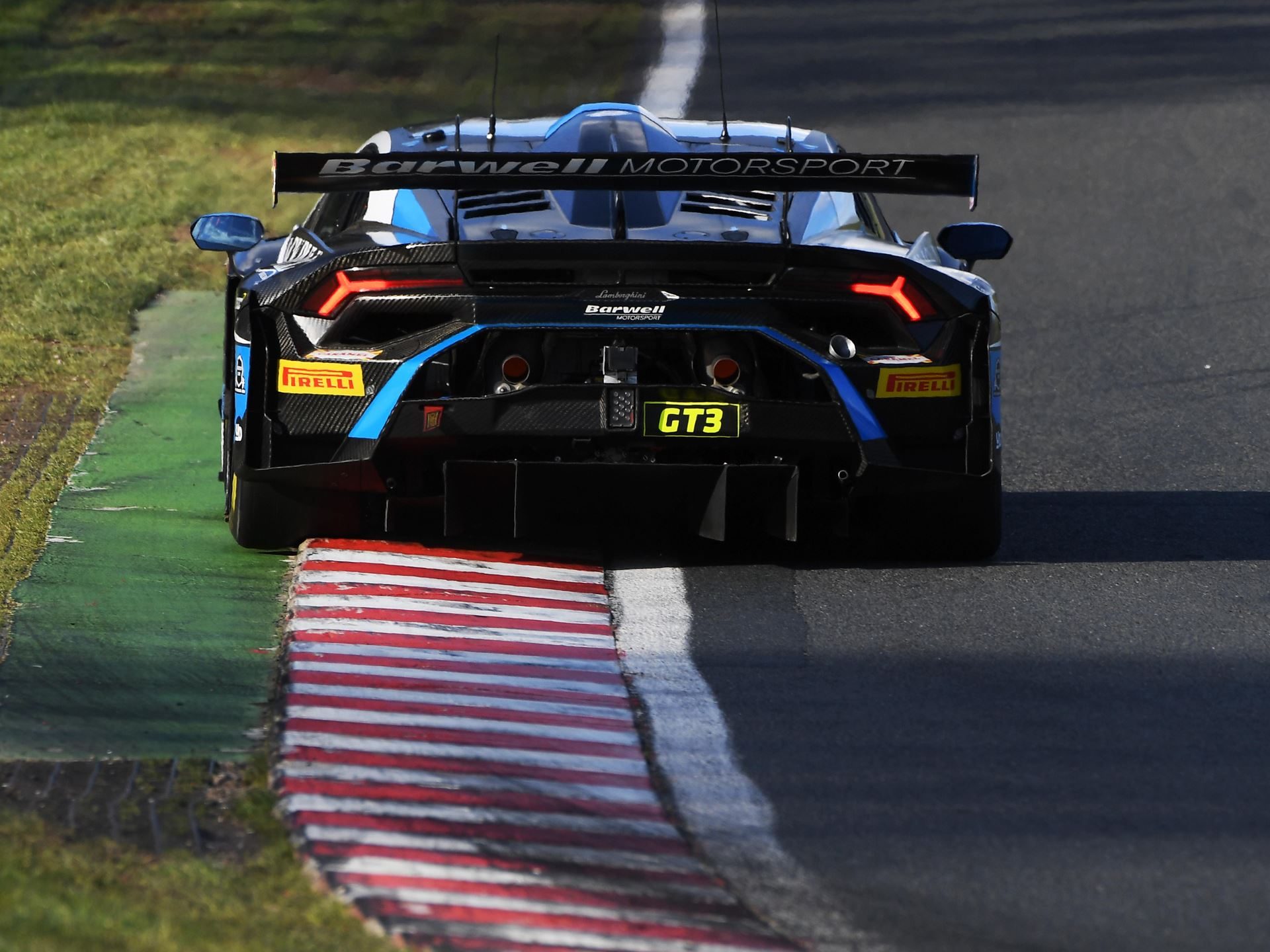 Two Huracán Gt3 Evo2S, Two Wins, One Soaking Wet Oulton Park: Why Lamborghini'S British Gt Opener Matters Beyond The Trophies 3 Rear view of the lamborghini huracán gt3 evo2 number 63 showing its large rear wing, prominent diffuser, and pirelli-branded tires on track